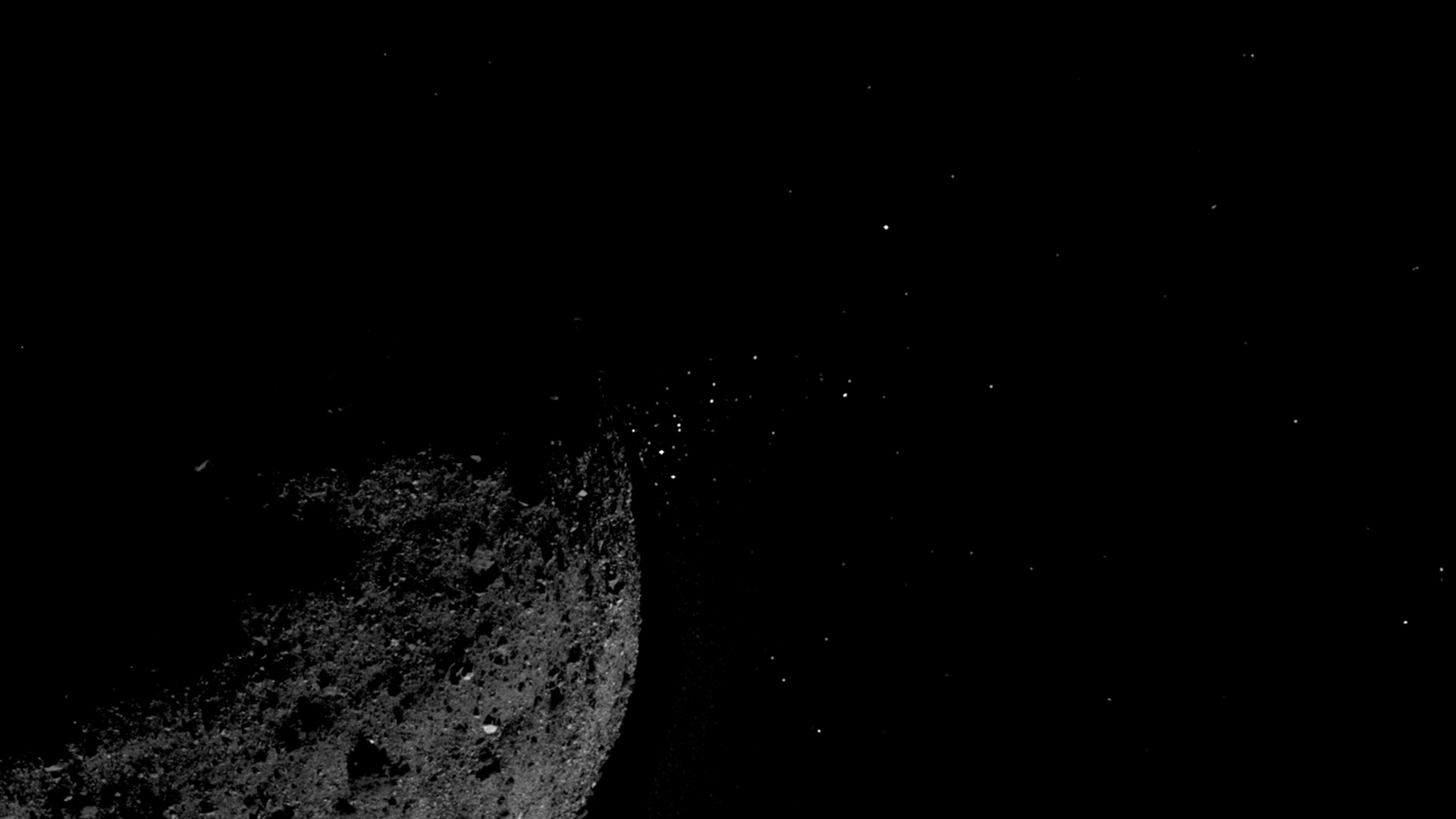 OSIRIS-REx photograph shows material being ejected from the surface of the asteroid Bennu in January 2019.