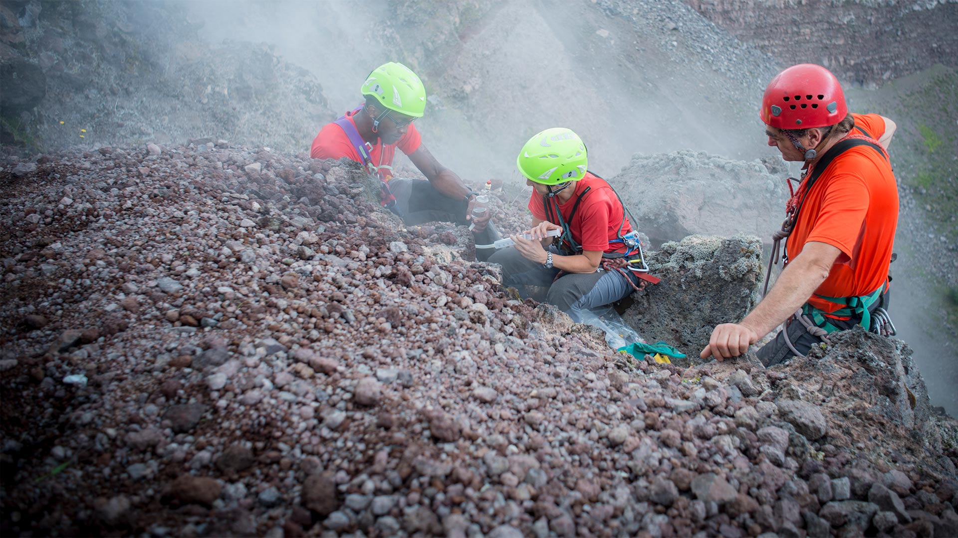 Chris Jackson, Rosanna D'Arienzo and Berardino Bocchino collecting gases from Vesuvius crater.
