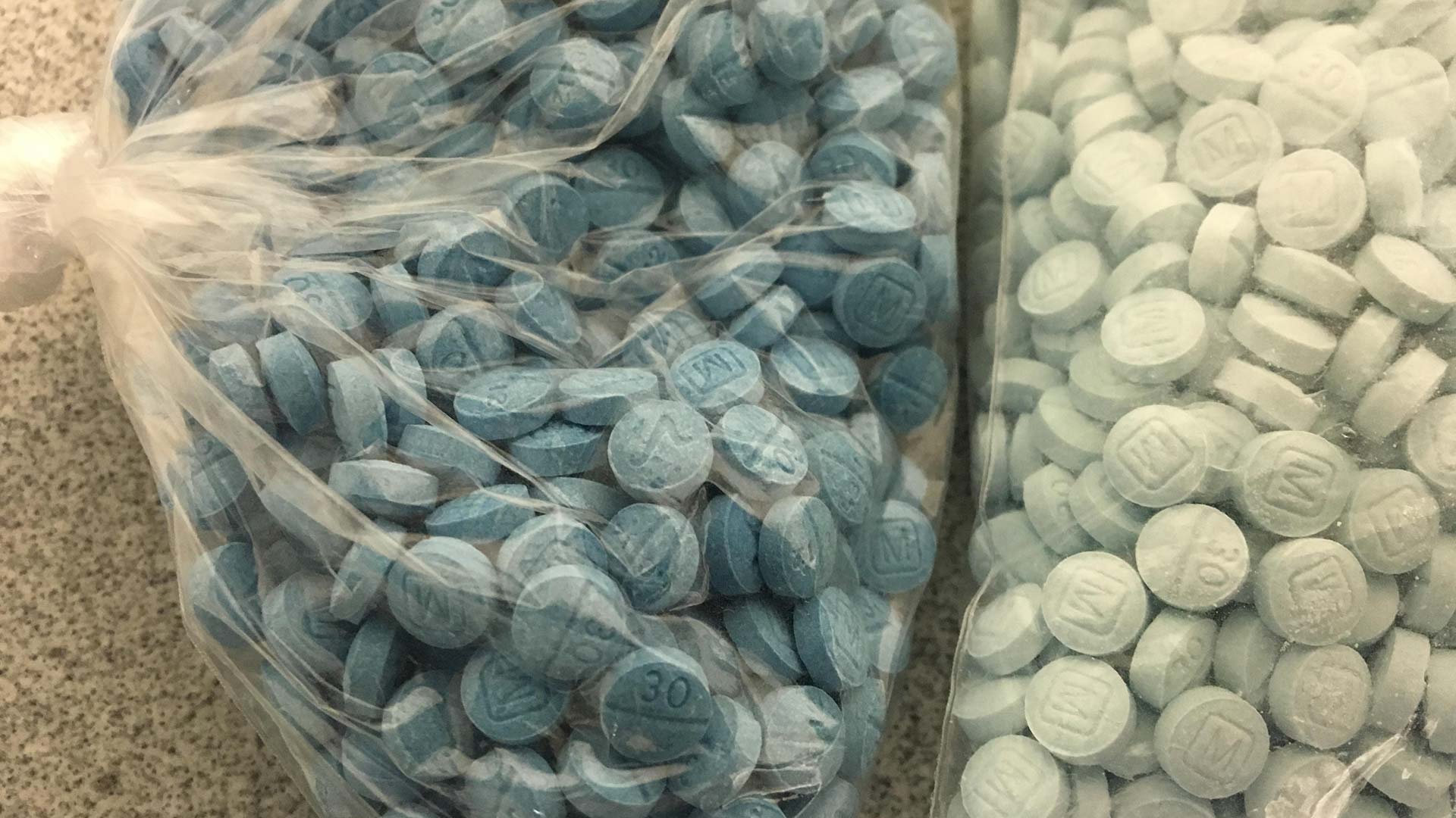 Image released by the DEA in September 2018 of blue pills the agency says are fentanyl disguised as oxycodone.