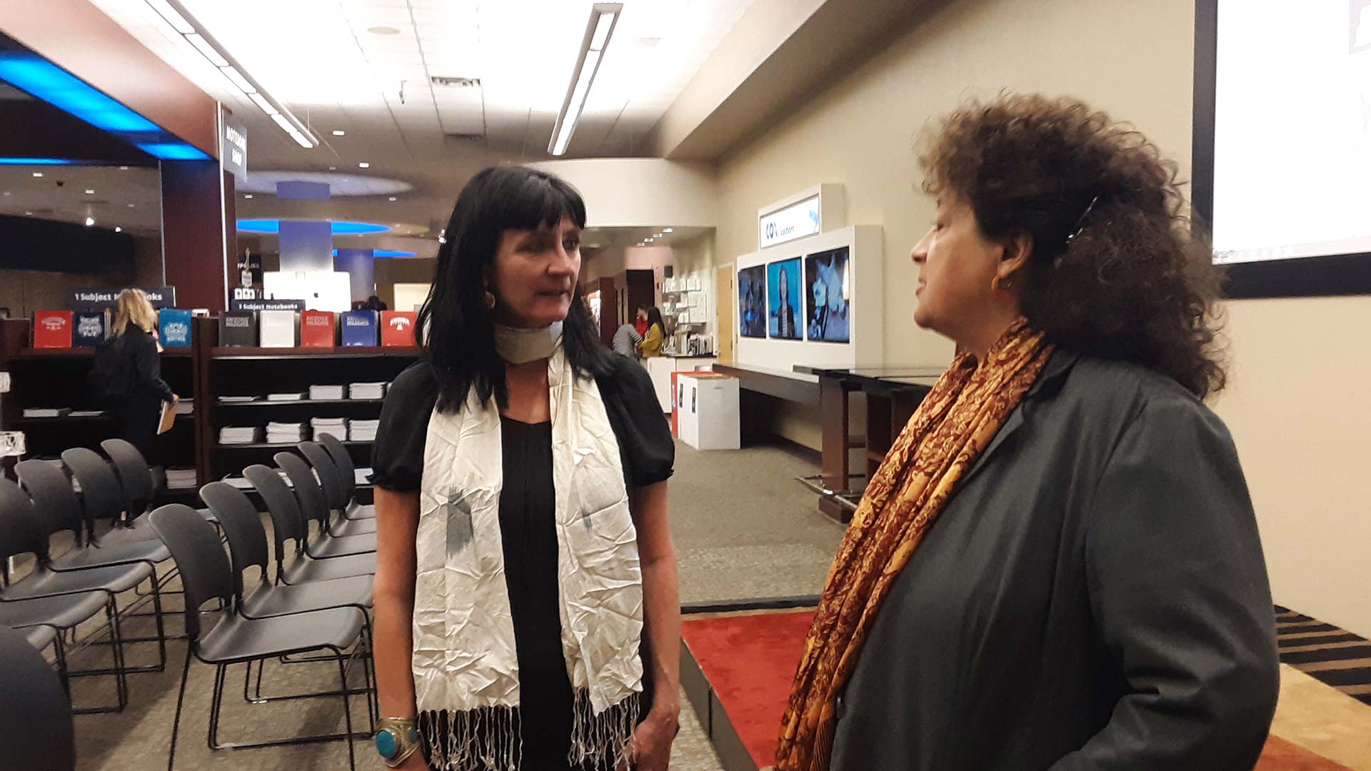 International journalist Joanna Lillis, left, speaks with University of Journalism professor Maggy Zanger at the UA Bookstore Feb. 4.