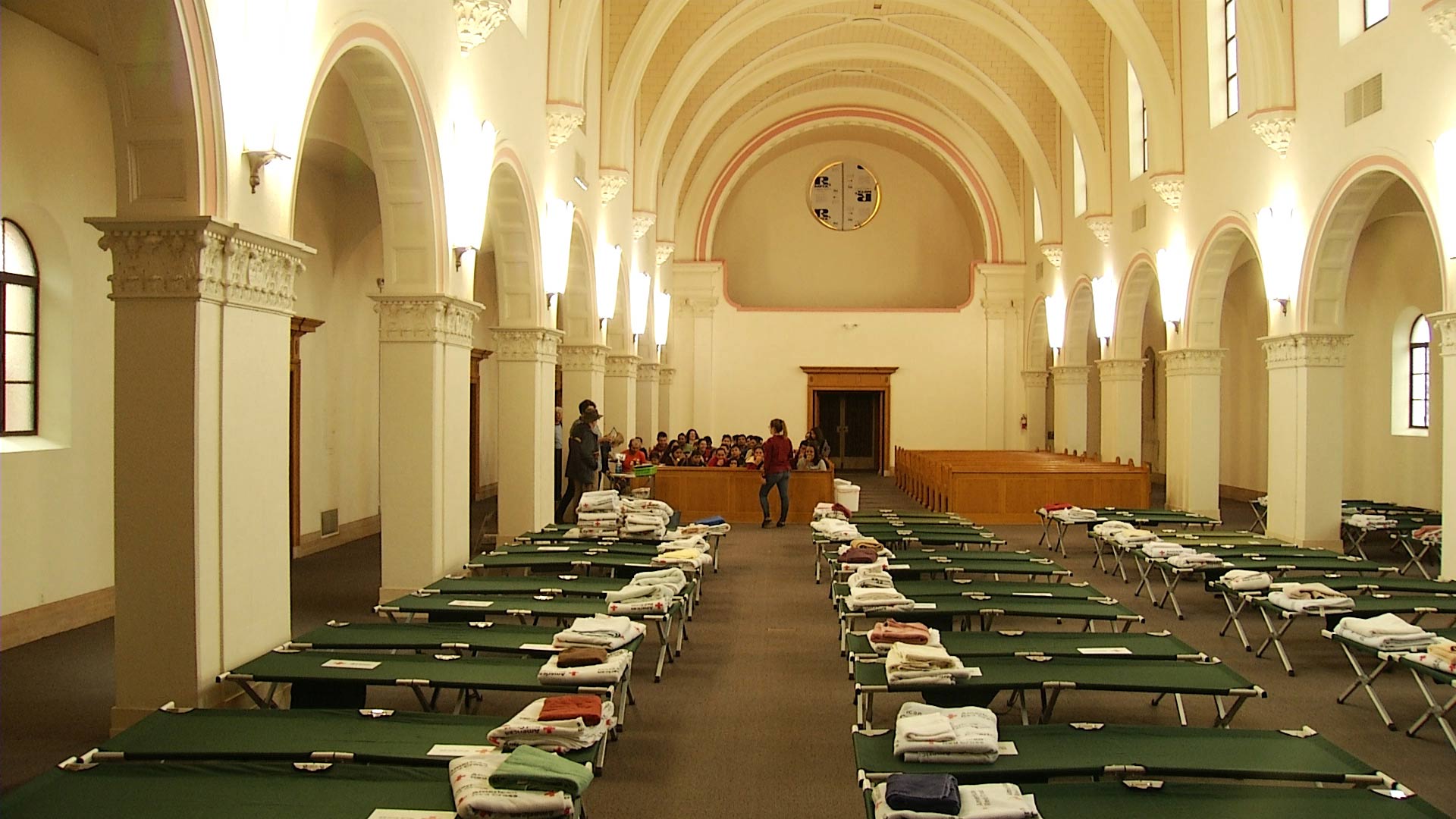 Rows of cots are set up inside the Benedictine Monastery in February 2019. The monastery served as a temporary shelter for migrant families seeking asylum. 