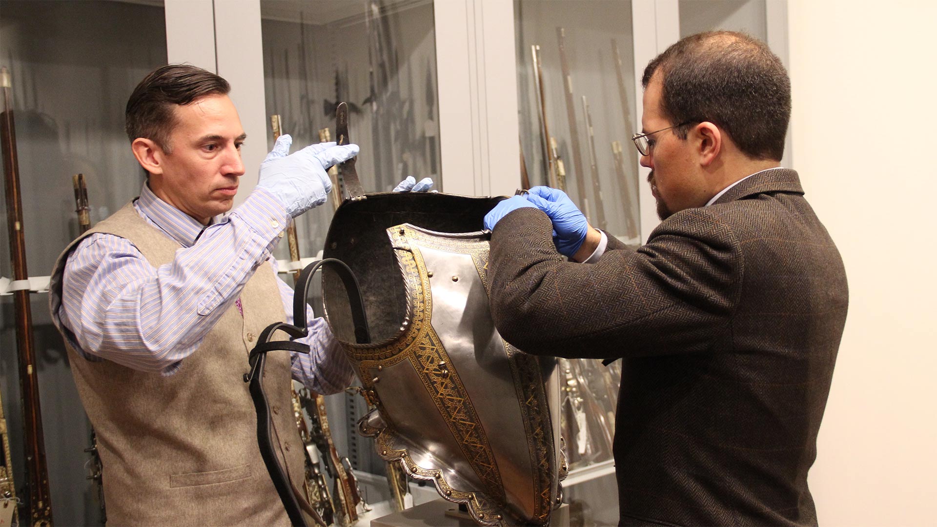 Armorer Jeff Wasson and Associate Curator of Arms and Armor Jonathan Tavares examine a 16th century armor at the Art Institute of Chicago. 