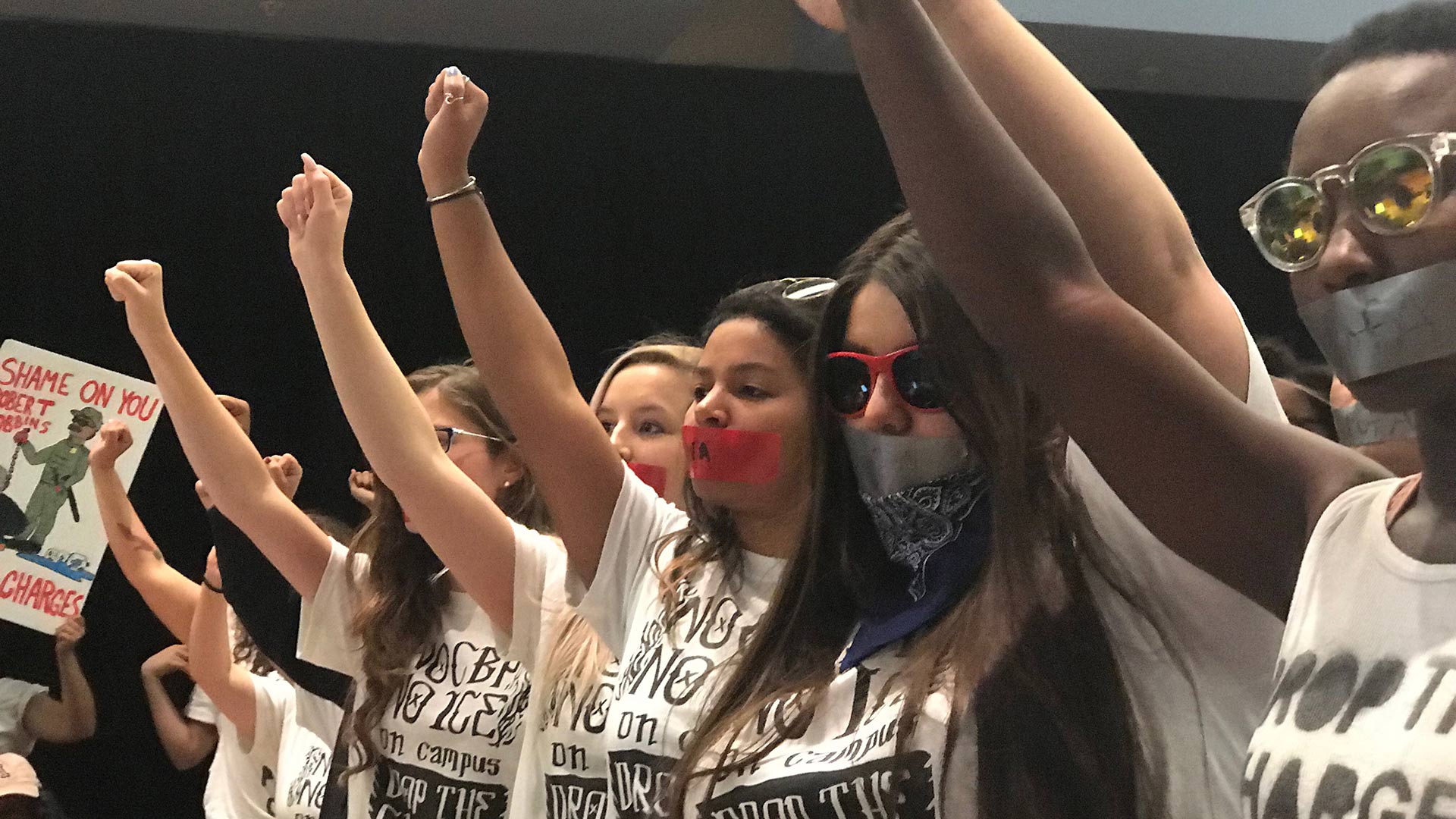 Silent protest by University of Arizona students and supporters at an April 11, 2019 Arizona Board of Regents meeting. They want U.S. Border Patrol banned from campus following events in March that resulted in charges against student protesters.