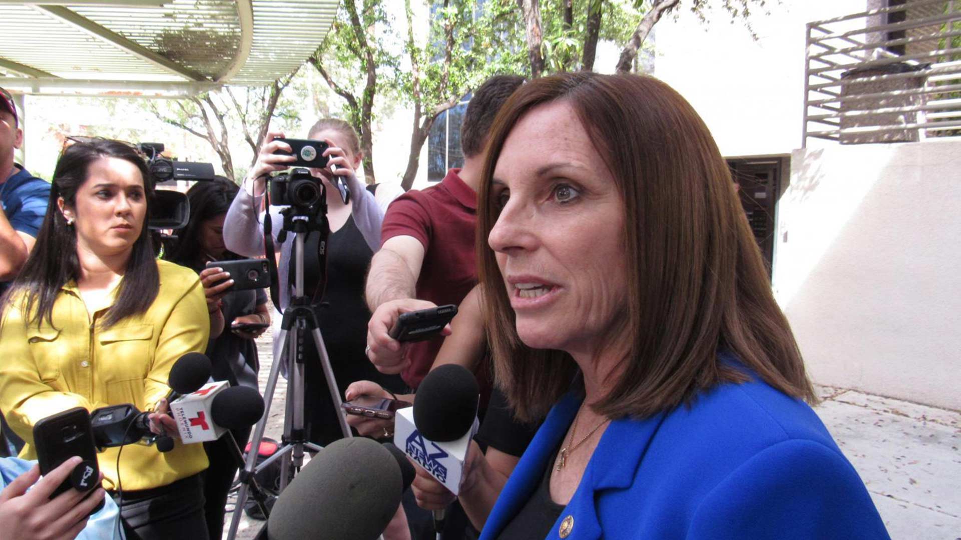 U.S. Sen. Martha McSally answers questions from reporters outside the Phoenix office of U.S. Immigration and Customs Enforcement on April 1, 2019.