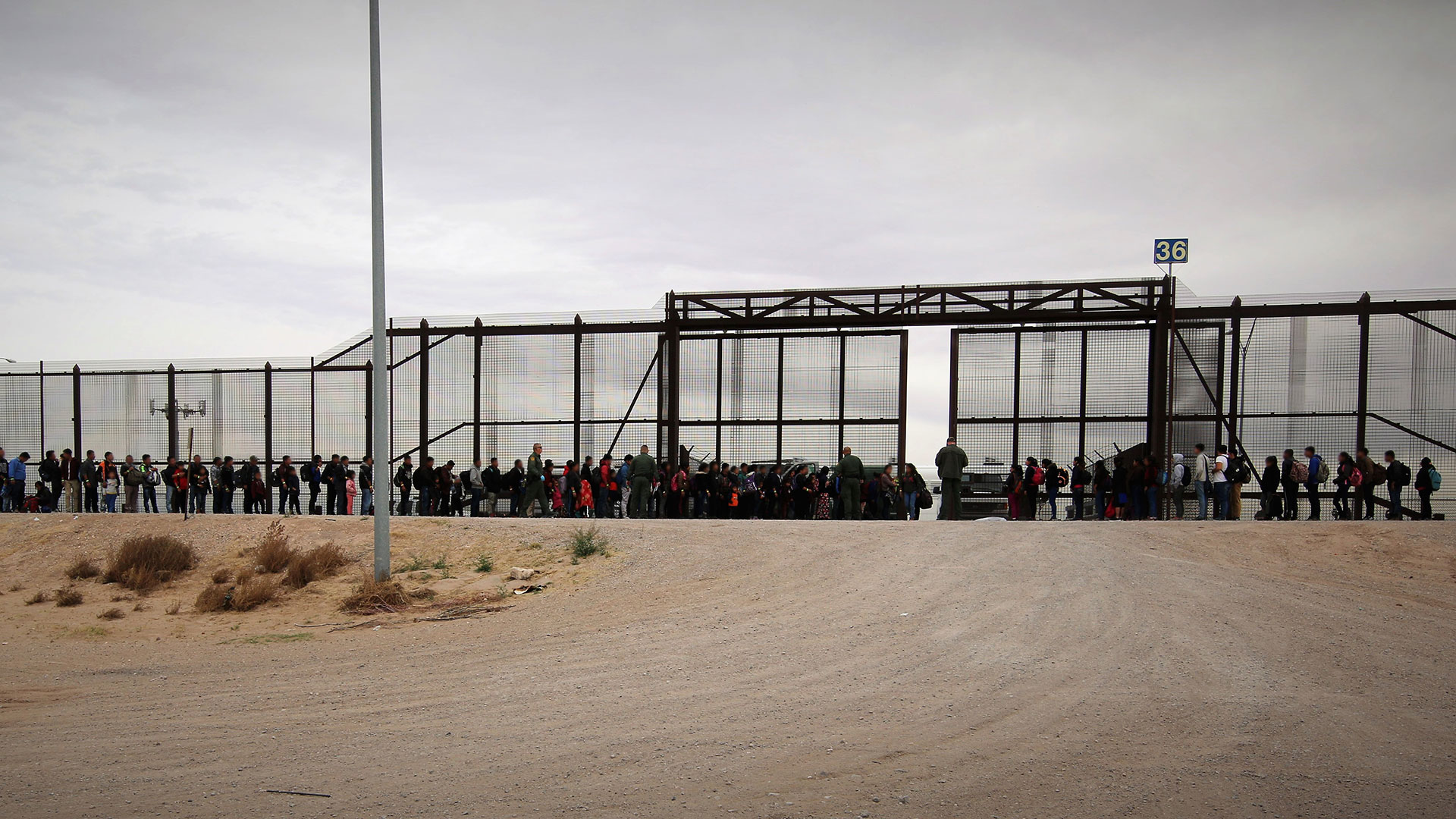 This March 7, 2019 Customs and Border Protection photo shows a group of more than 100 migrants lined up at the border in the El Paso Sector.