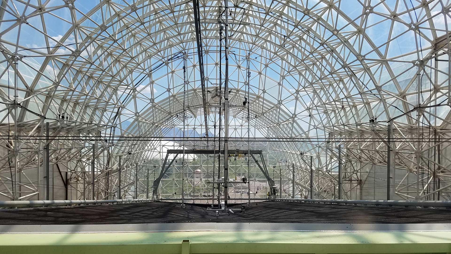 The surface of LEO looking down one of the three slopes. The greenhouse above the slope is the same greenhouse that was used for agricultural purposes when humans lived in the Biosphere 2 in the early 90s.
