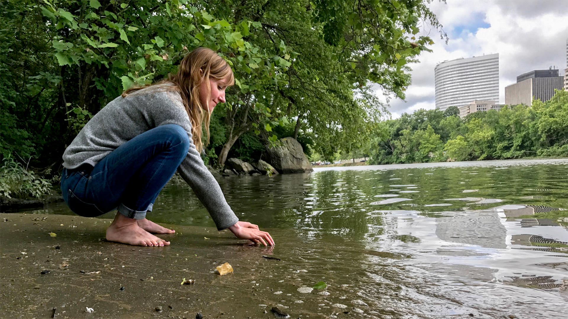 Clare Kelley practices "forest bathing" along the edge of an urban forest on Roosevelt Island, in the middle of the Potomac River. In contrast to hiking, forest bathing is less directed, melding mindfulness and nature immersion to improve health.
Allison Aubrey/NPR
