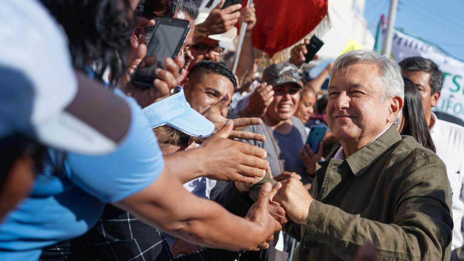 Mexican President Andrés Manuel López Obrador is greeted by supporters in Tijuana, Mexico, before a rally, in this photo dated June 8, 2019.