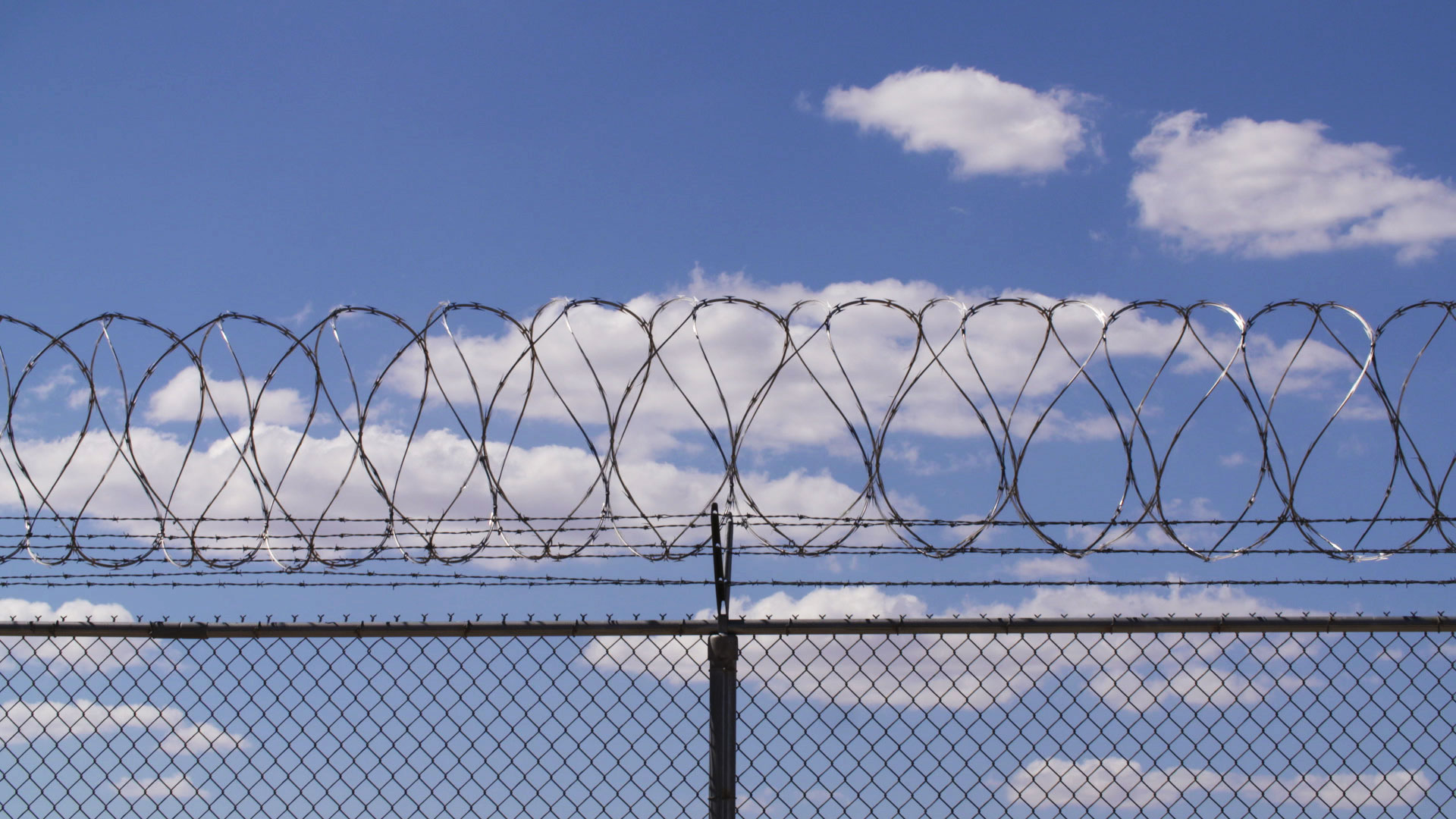 File image of razor wire lining a fence at a state prison in Arizona. 