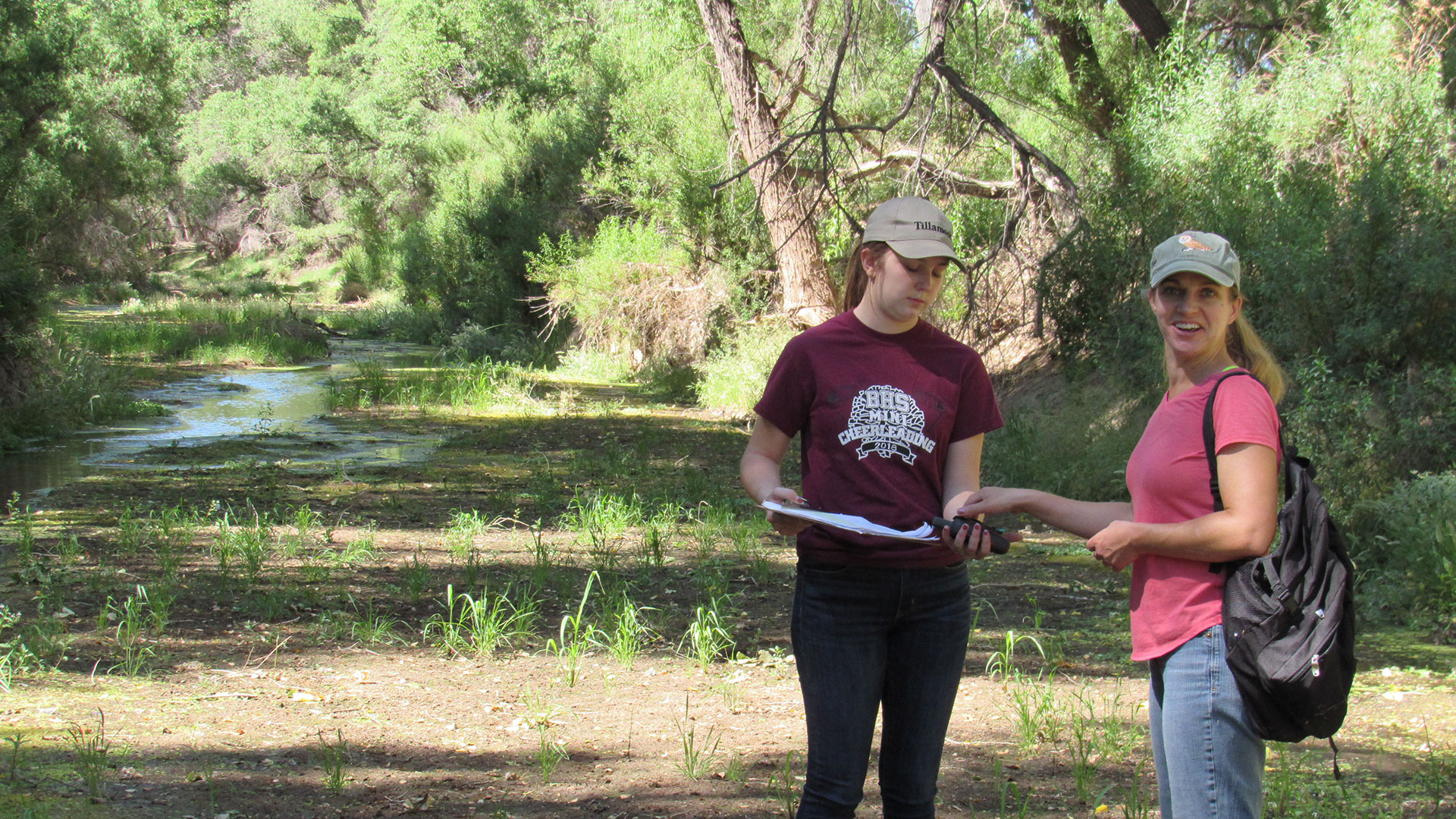 Volunteers Sara Ransom and Kaya Foss doing wet-dry mapping on the San Pedro River.