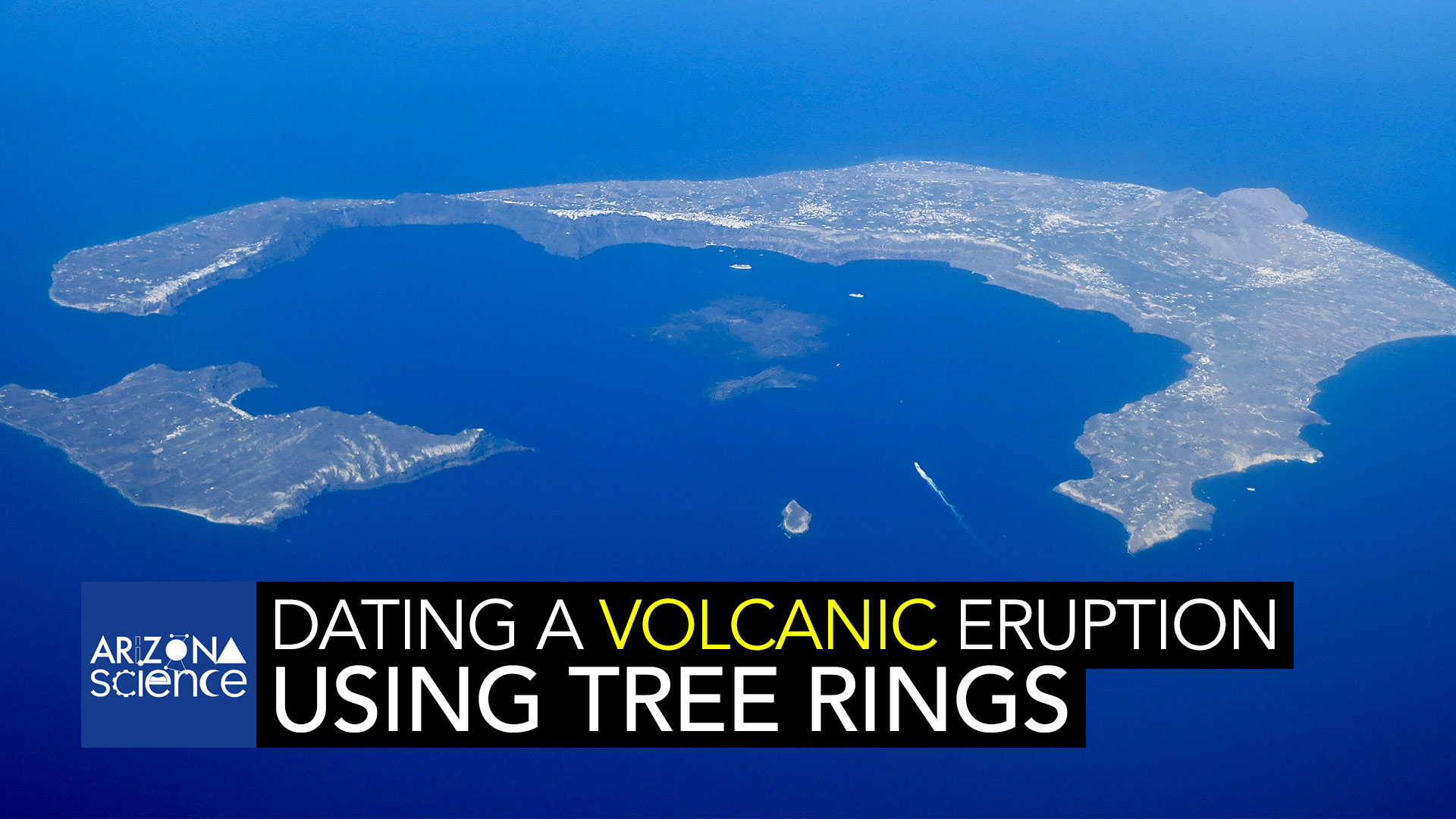 That was one massive volcanic burst and now just the lips of the volcano rise above sea level. The white parts along the ridge lines are cliff-hugging buildings.