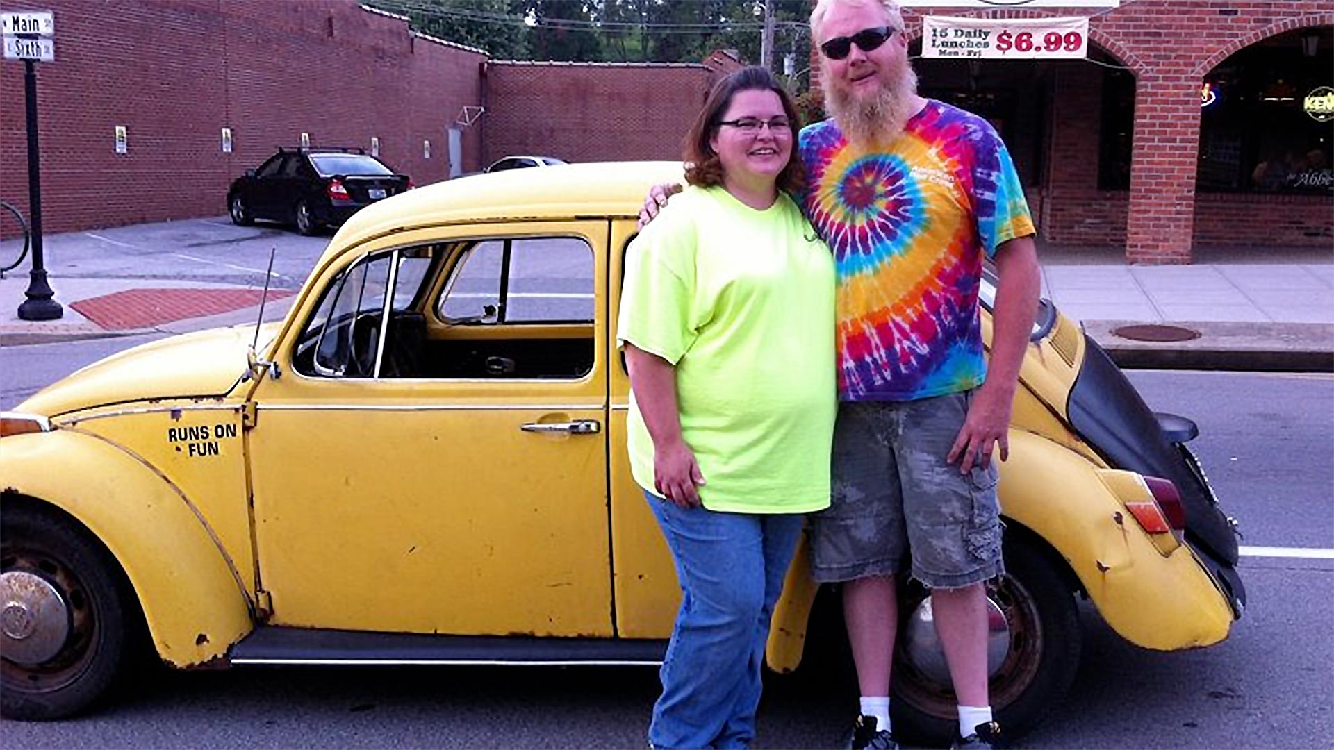 Jessica Bray and her husband, Anthony Bray, pose with their 1970 Volkswagen Beetle. Anthony converted his Beetle to an electric car. "As a special touch, we added bubble machines to the back to blow bubbles at car shows and as we drive," Jessica said.