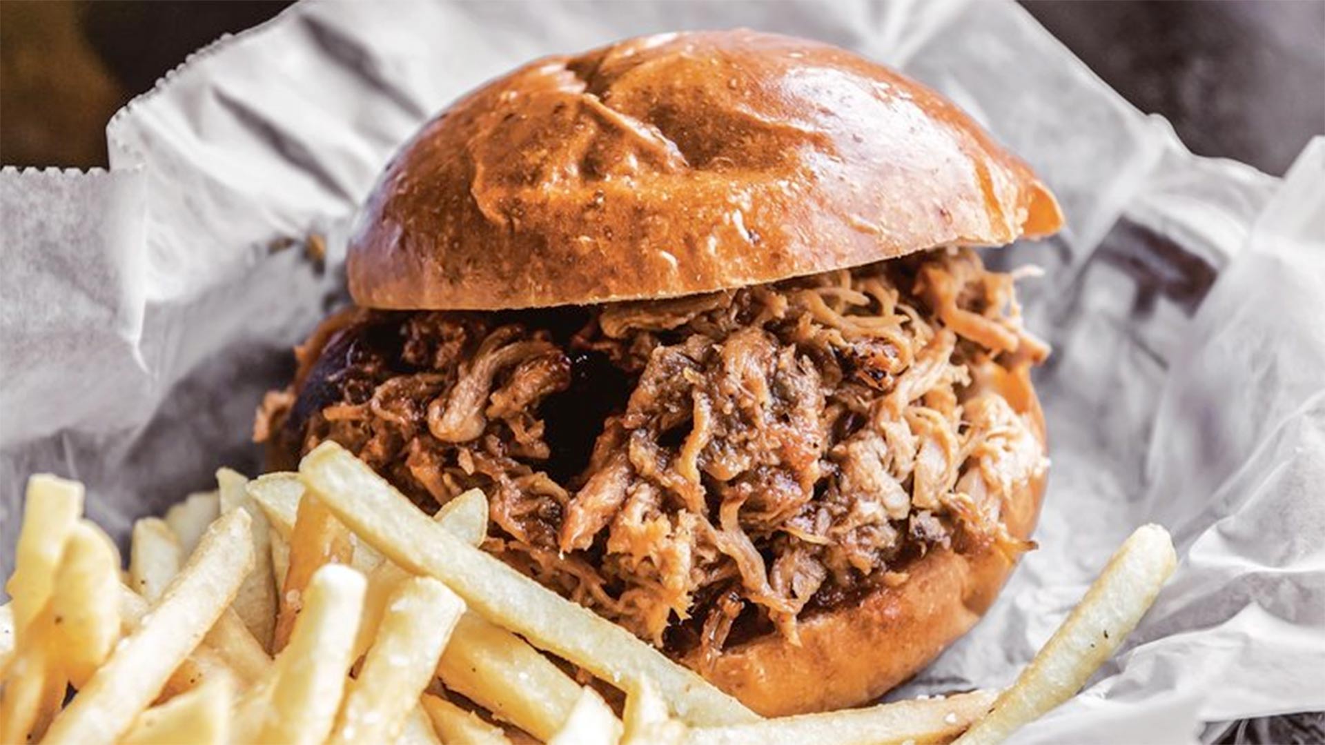A smoked pulled chicken sandwich from Operation BBQ Relief.
