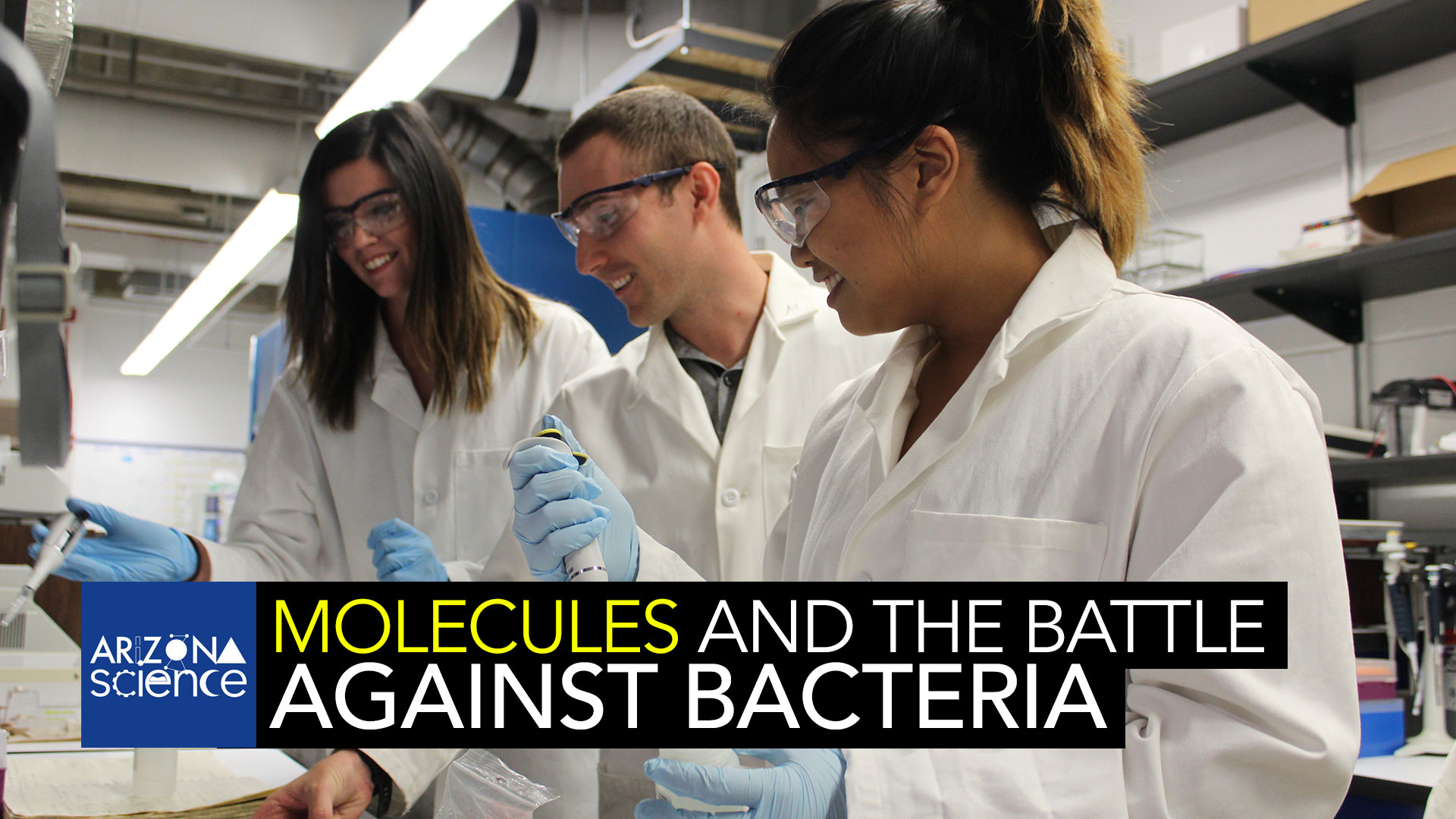 UA professor Michael Marty, center, with two students in his biochemistry lab. 