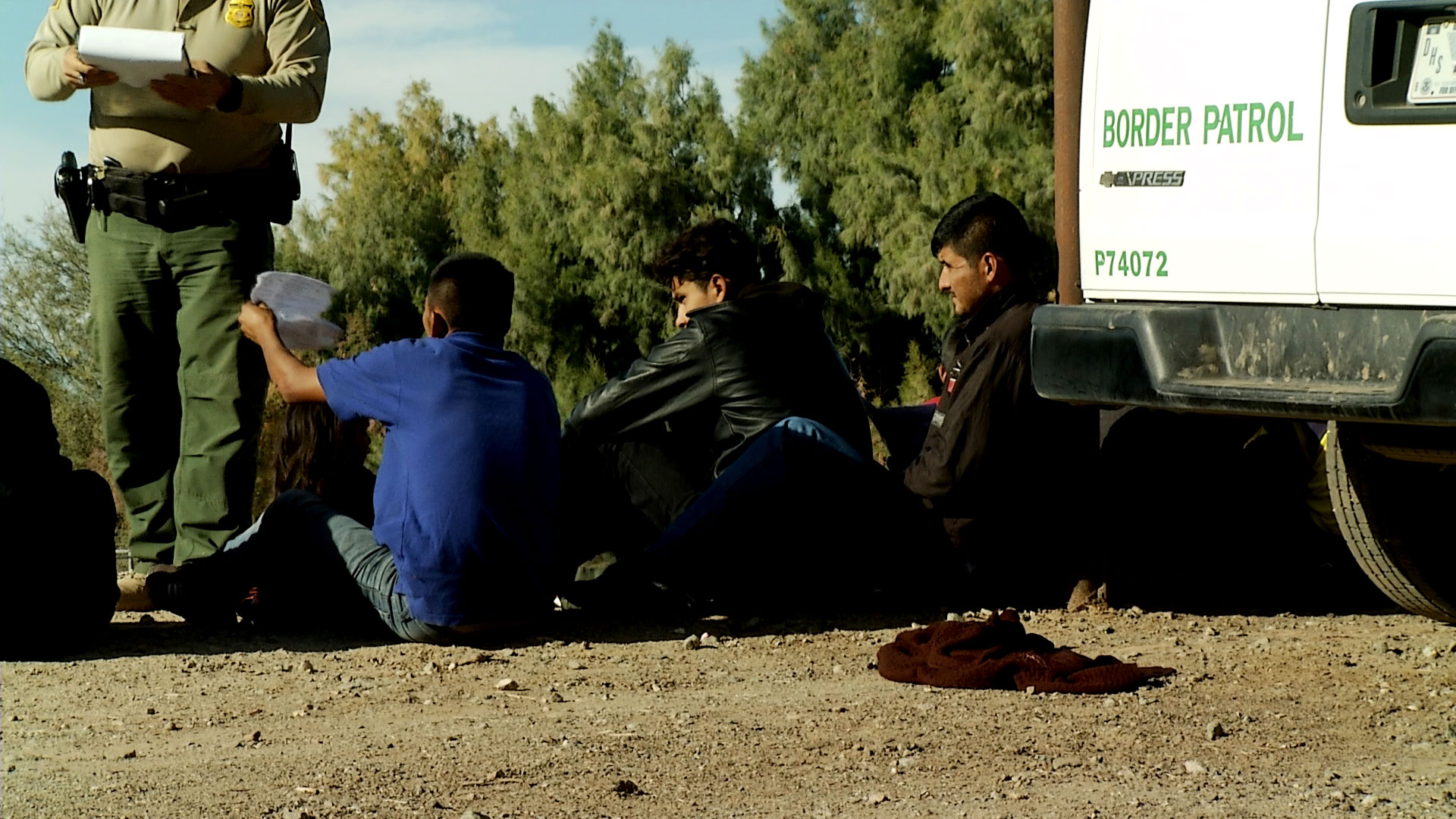 A Border Patrol agent begins processing a group of immigrants apprehended in Yuma in December 2018. 