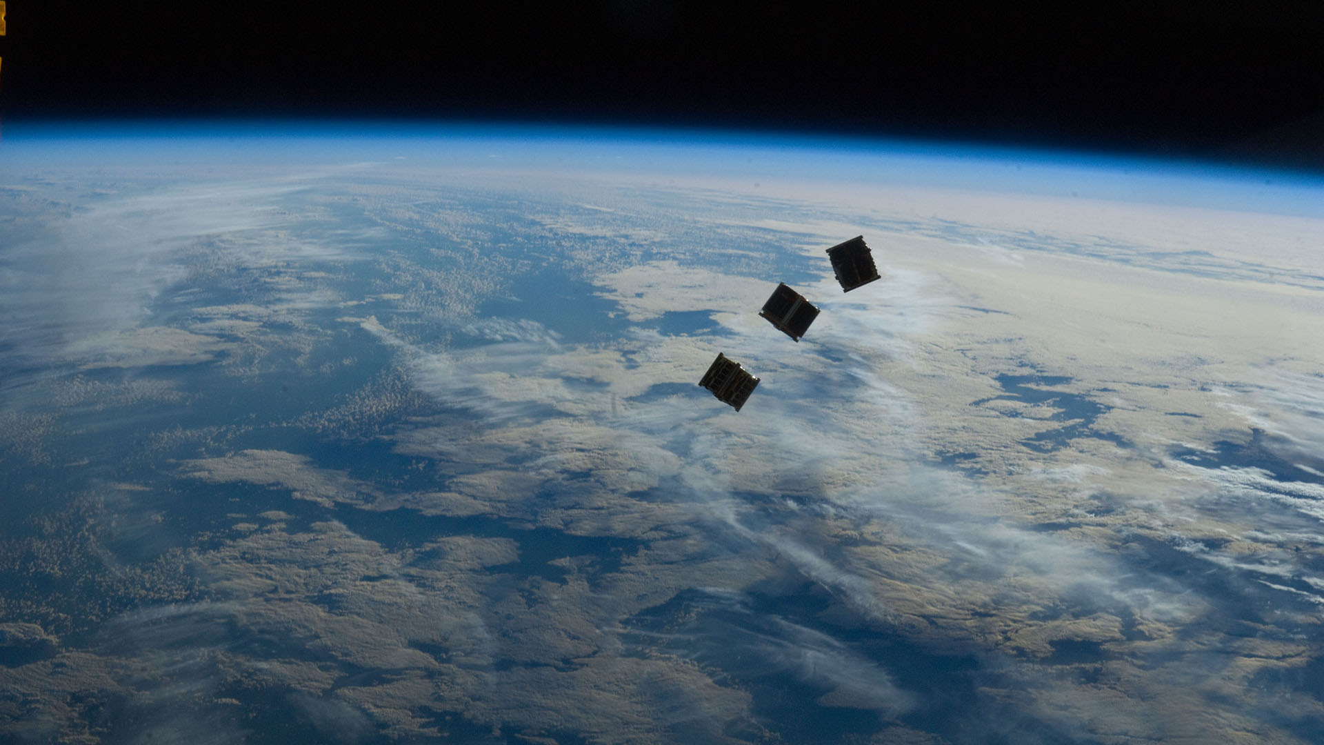 Three tiny satellites deployed from the International Space Station. Scientists warn satellites are becoming smaller and harder to track from Earth.