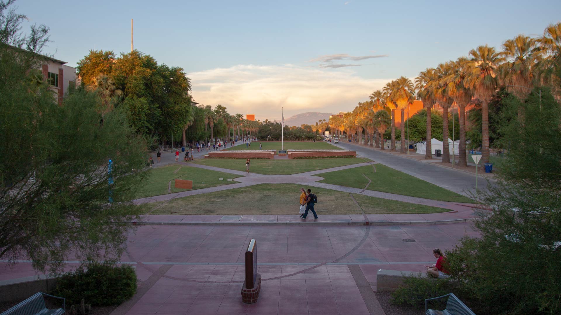 Students walk along the mall on the campus of the University of Arizona. From August, 2019.