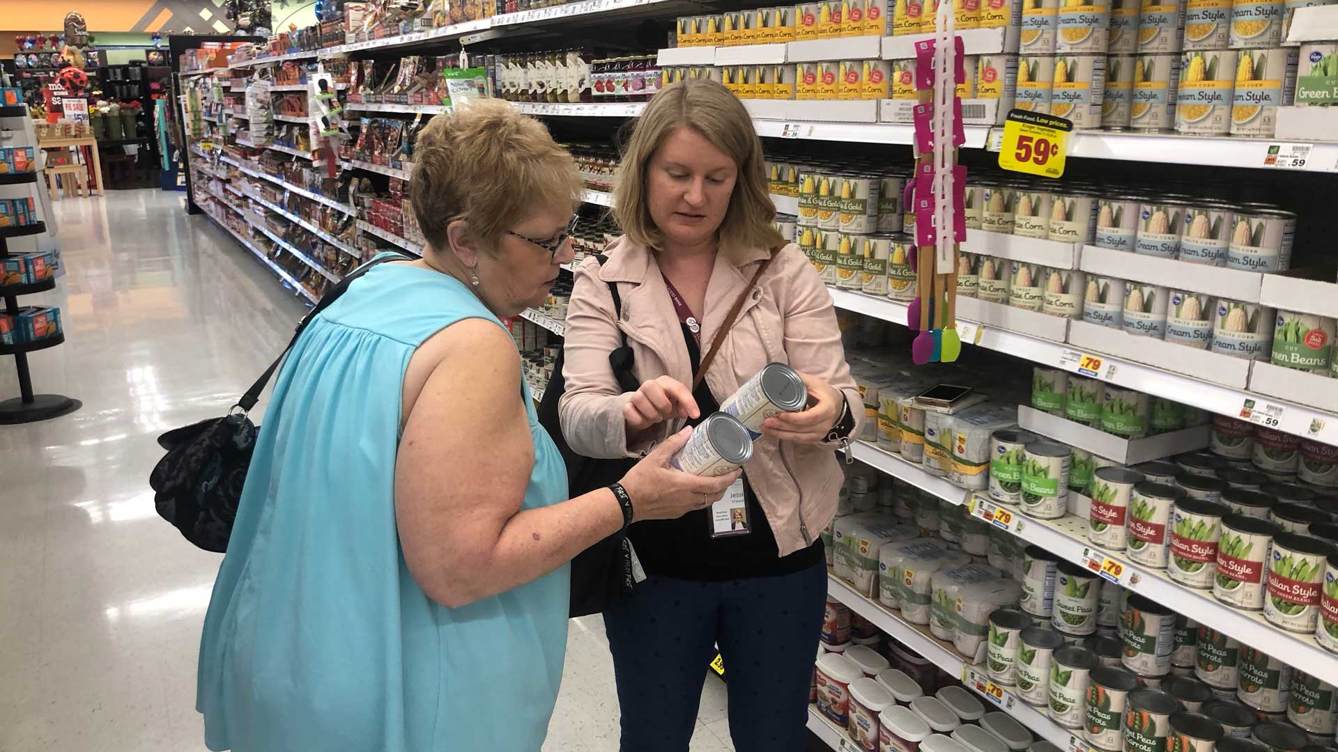 Jessica Sheava of the Foodbank of Southern Arizona talks nutrition and price with client Kathy Abbazia