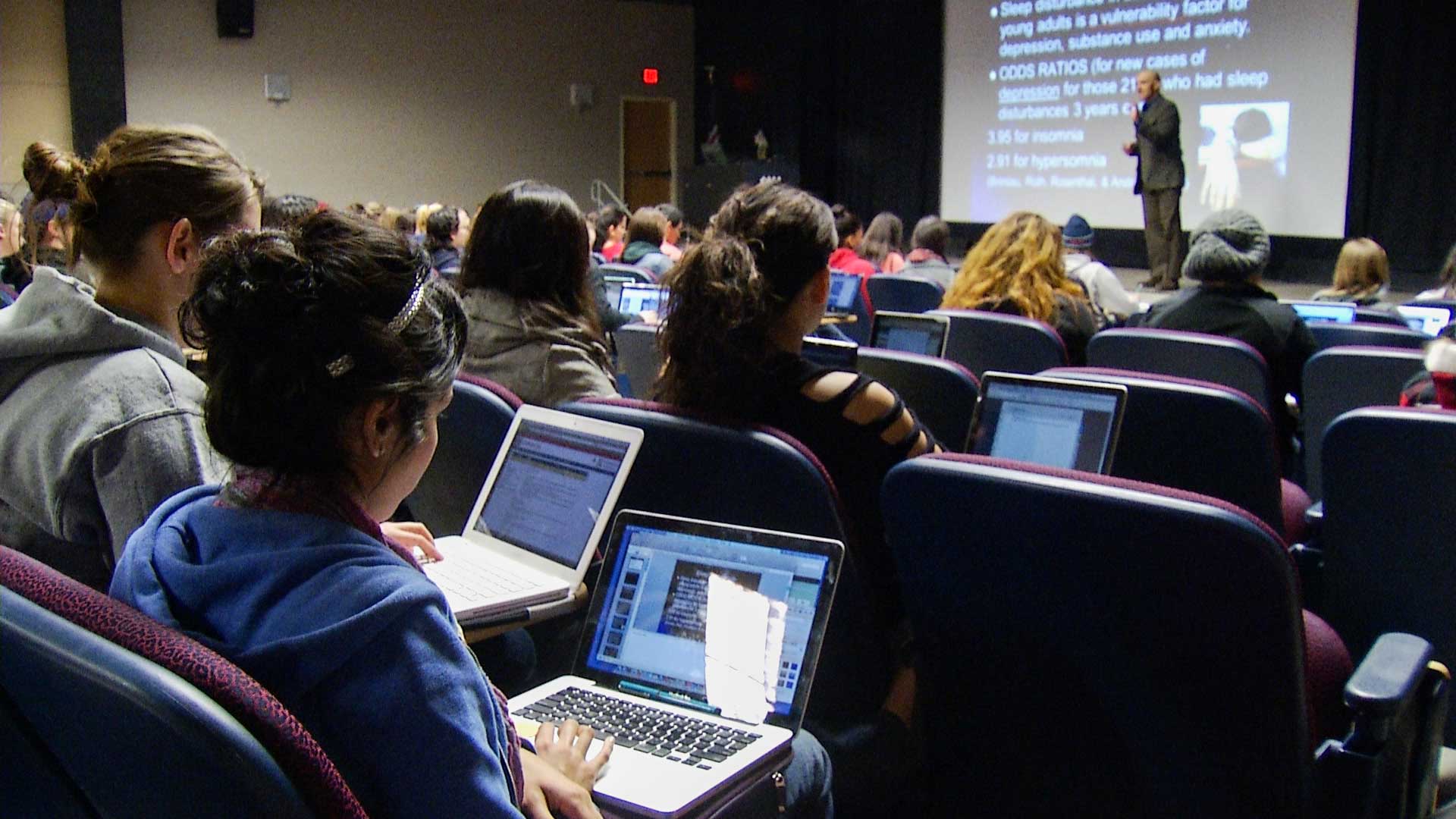 Students follow a lecture at the University of Arizona.