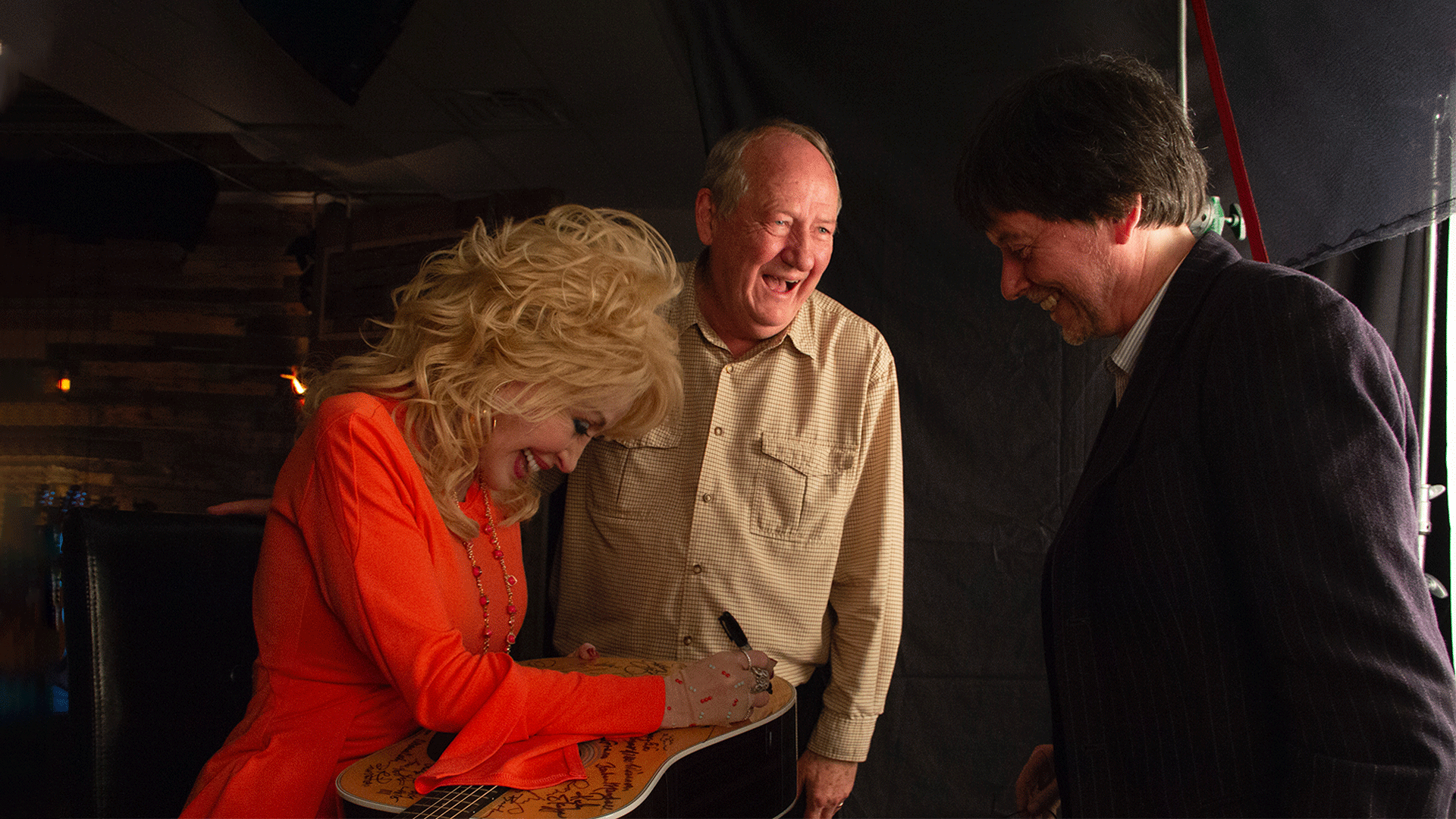 Dolly Parton signs Martin D-28 guitar. Parton is among the 76 of the 101 country music artists interviewed for the series who signed two Martin D-28 guitars.