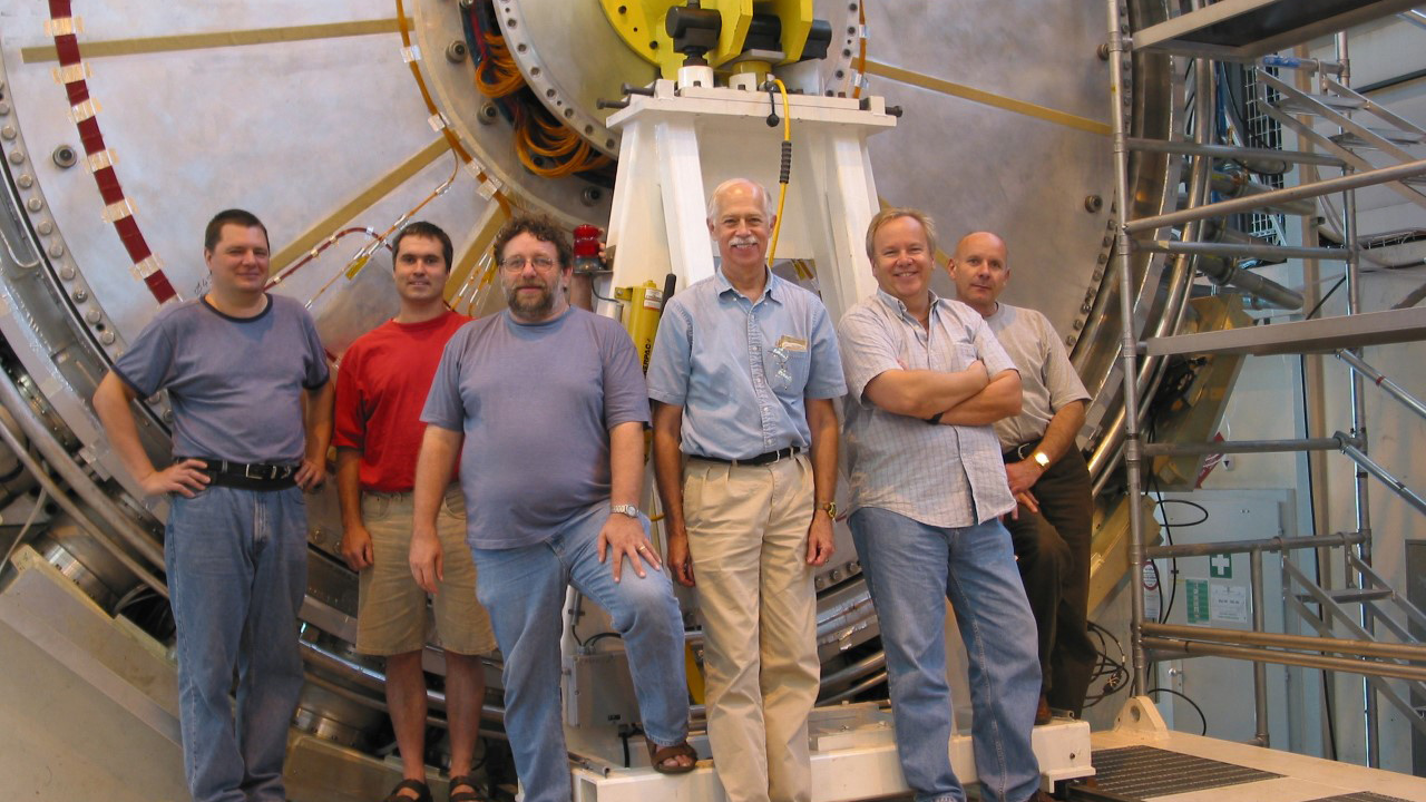 UA professor John Rutherfoord (3rd from right) with colleagues at the Large Hadron Collider.