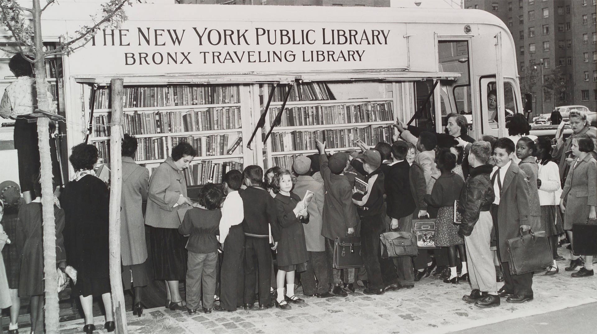 Children in the Bronx visit a New York Public Library bookmobile in the 1950s. The institution turns 125 this year.