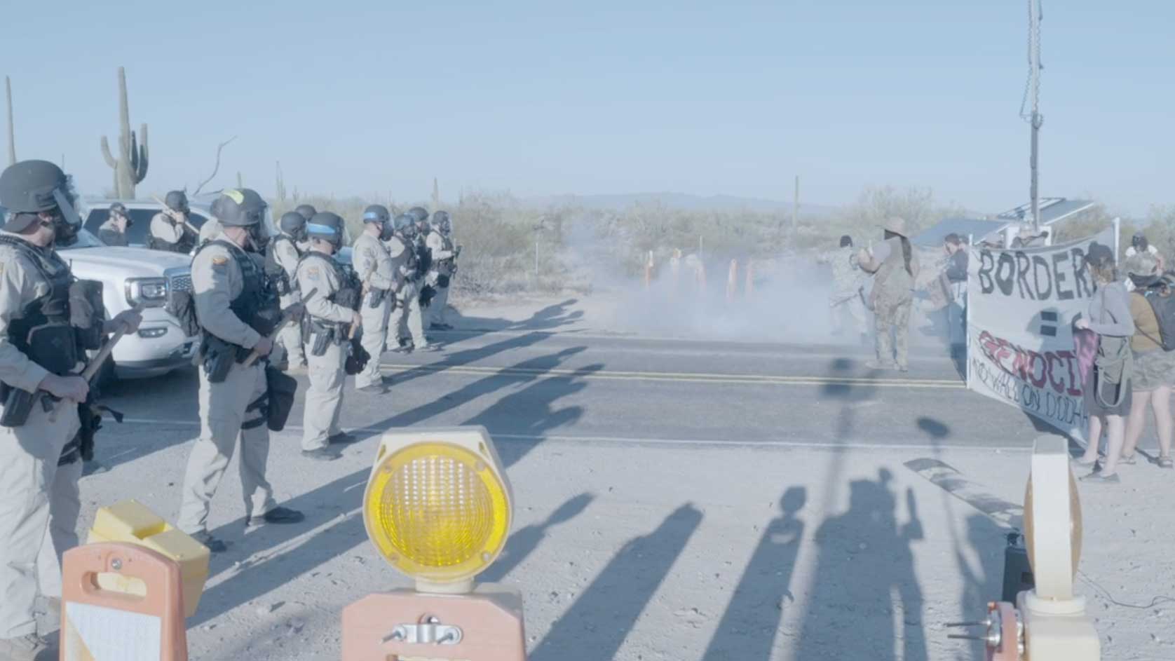 A line of DPS officers forms in front of an Indigenous Peoples' Day Protest north of the Lukeville Port of Entry on Oct. 12, 2020.