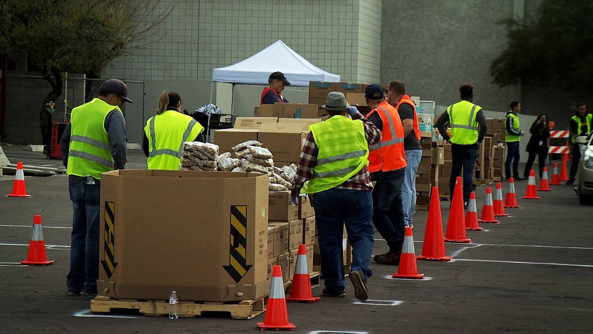 Volunteers prepare to distribute food in a drive-thru line organized by the Community Food Bank of Southern Arizona. March 2020. 