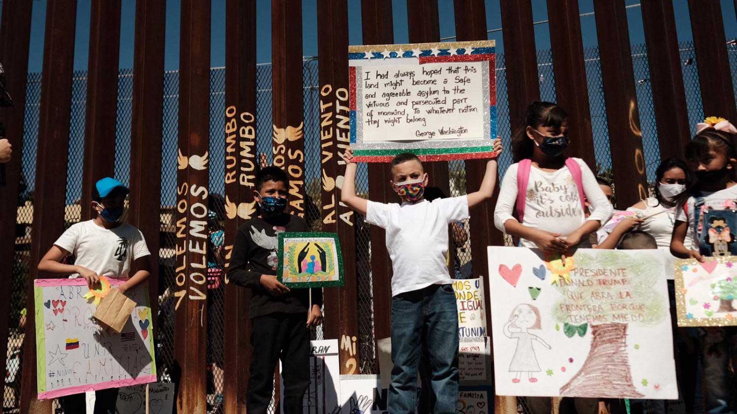 Children who are waiting for asylum in the United States with their families in Nogales, Sonora, marched to the border wall Wednesday, Oct. 21, 2020, to ask the United States to open the border to them.