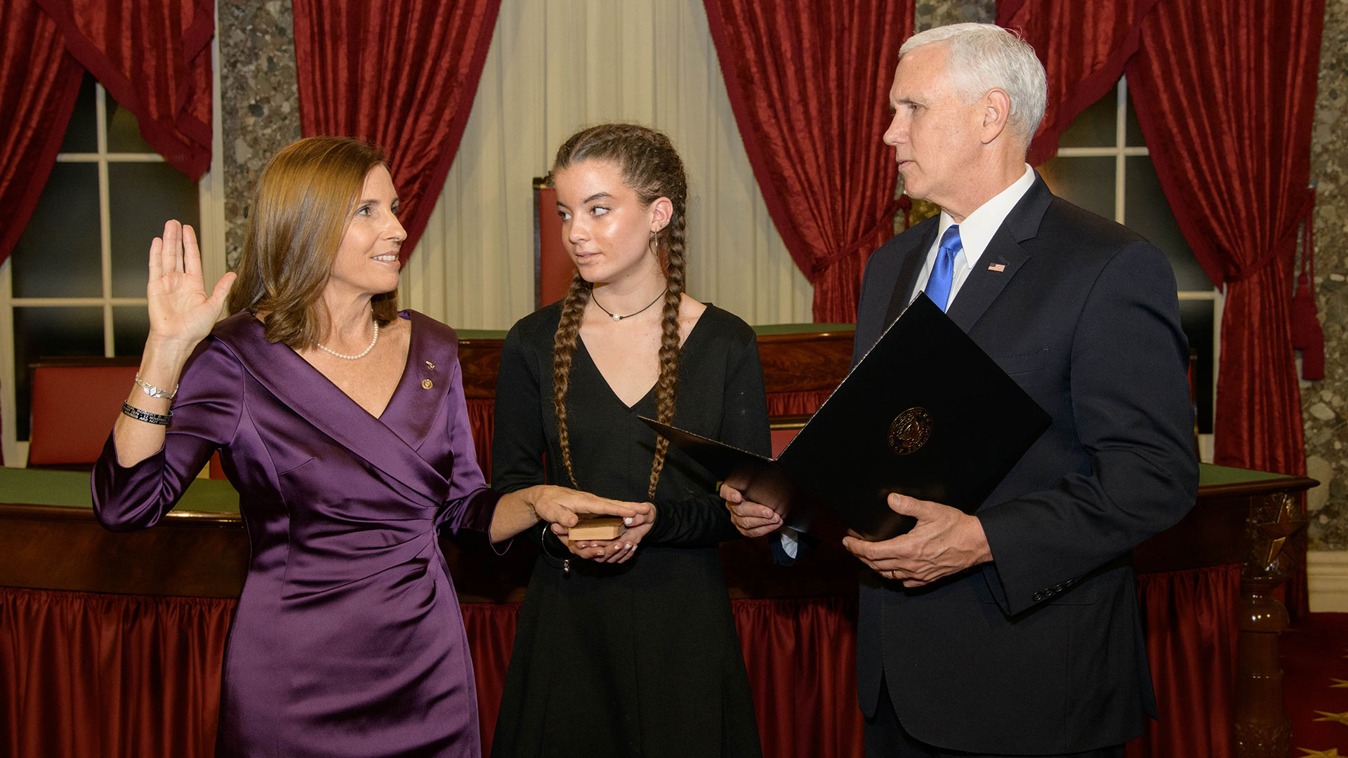 Sen. Martha McSally takes the oath of office for the U.S. Senate, January 4, 2019.  Vice President Mike Pence administered the oath while McSally's niece, Ella, held the bible.  McSally borrowed the bible for the University of Arizona Special Collections.  The copy of the New Testament was recovered from the body of an unknown sailor killed during the bombing of the U.S.S. Arizona in Pearl Harbor.