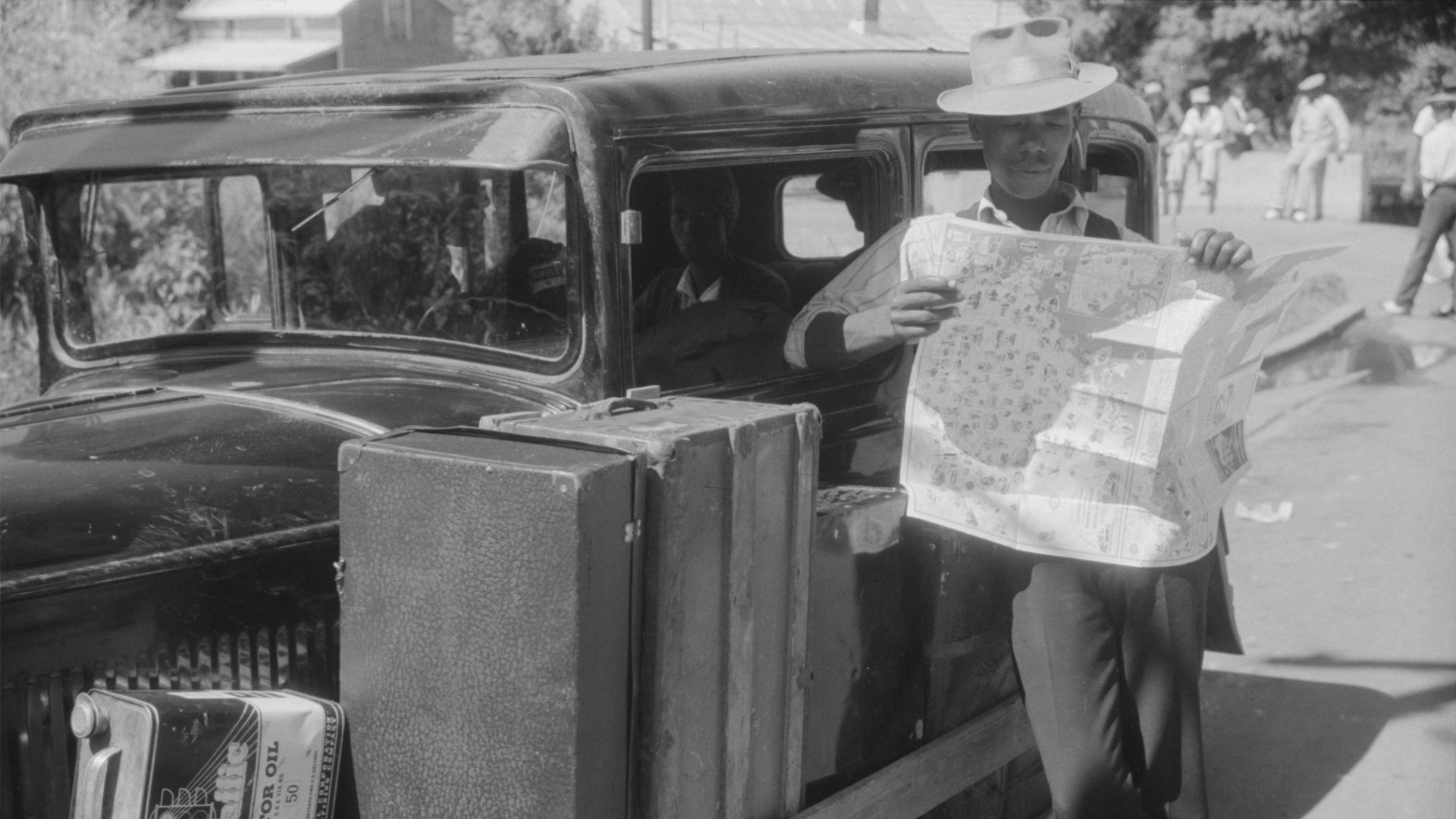 Granville Clarke, Florida migratory agricultural worker studying road map before leaving Elizabeth City with his crew. They are going to Bridgeville, Delaware to work in a cannery.