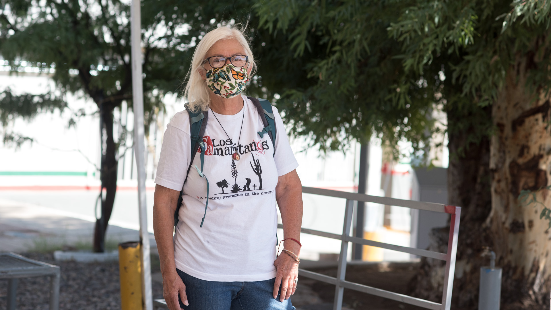 Gail Kocourek, 69, stands inside an area where migrants are processed on the Mexican side of the port of entry in Sasabe. This fall, Kocourek and other volunteers started making bi-weekly trips to the area to hand out food and water to migrants after they've been expelled by Border Patrol agents.