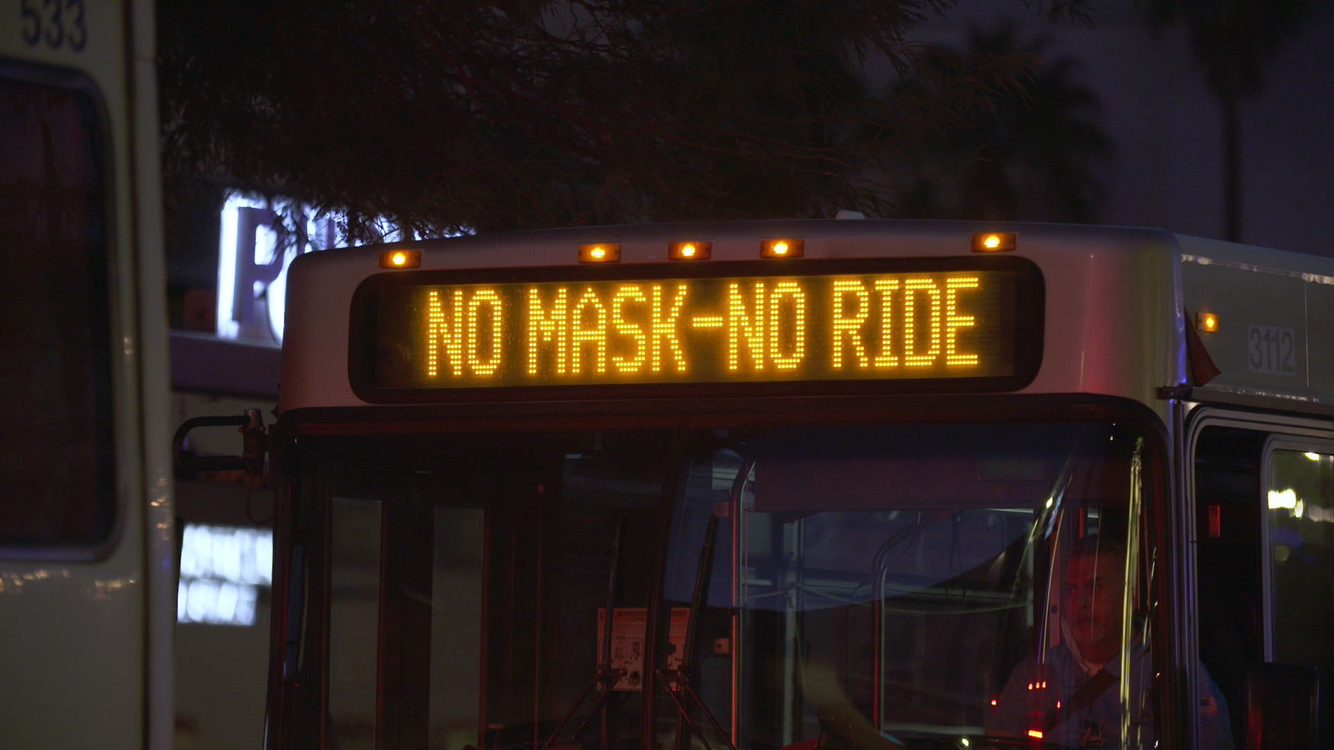 Sunlink bus sign announcing that masks are required to ride. 