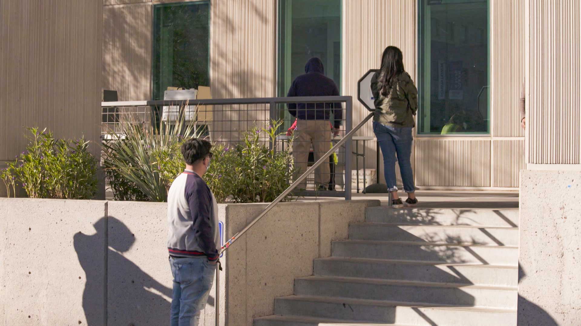 Pima County residents wait in line to cast an early ballot outside the Pima County Public Service Center in Tucson.