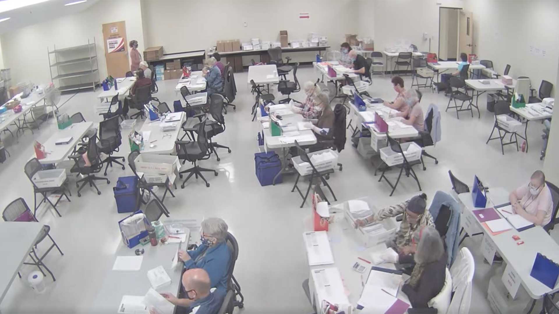 Pima County election workers process ballots the morning of Nov. 5, 2020 in this still image from the live feed of the early/provisional ballot processing room.