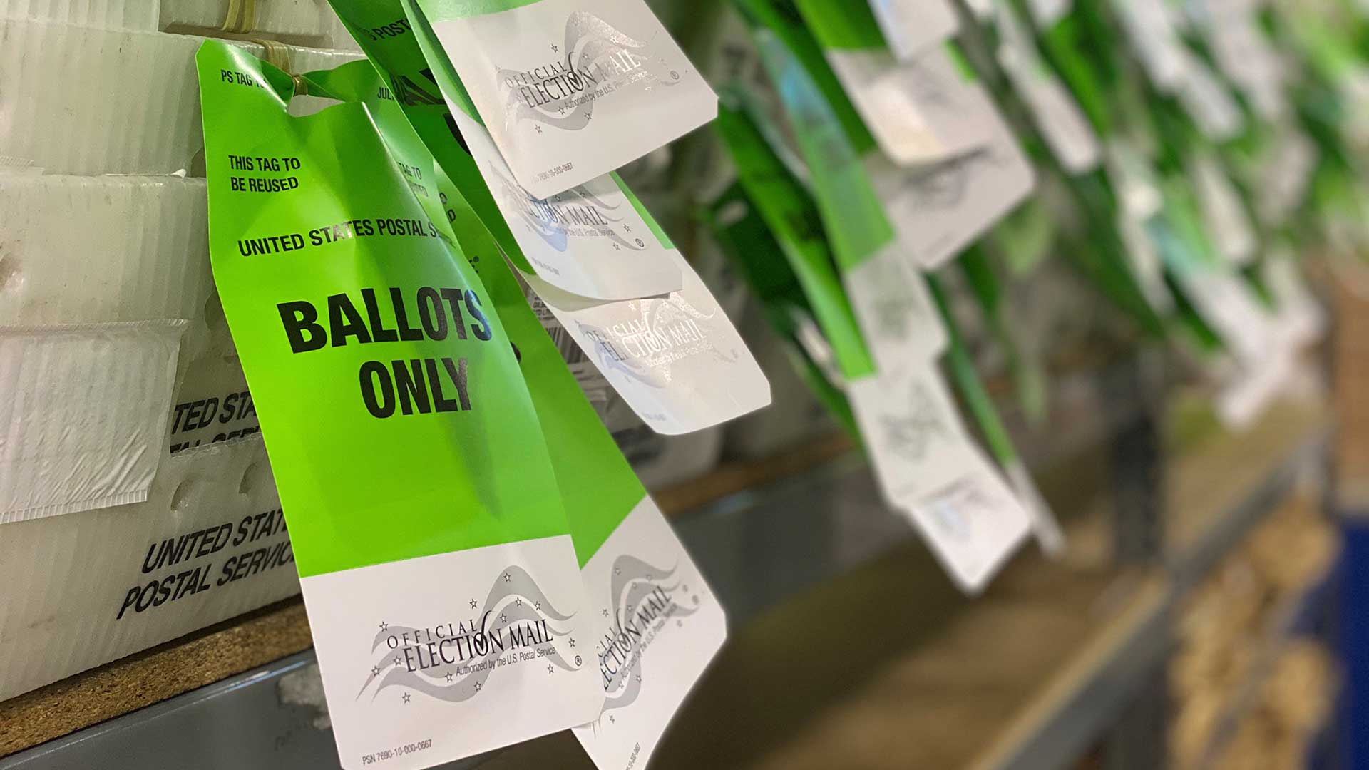 Postal bins with tags for ballots in the 2020 general election.