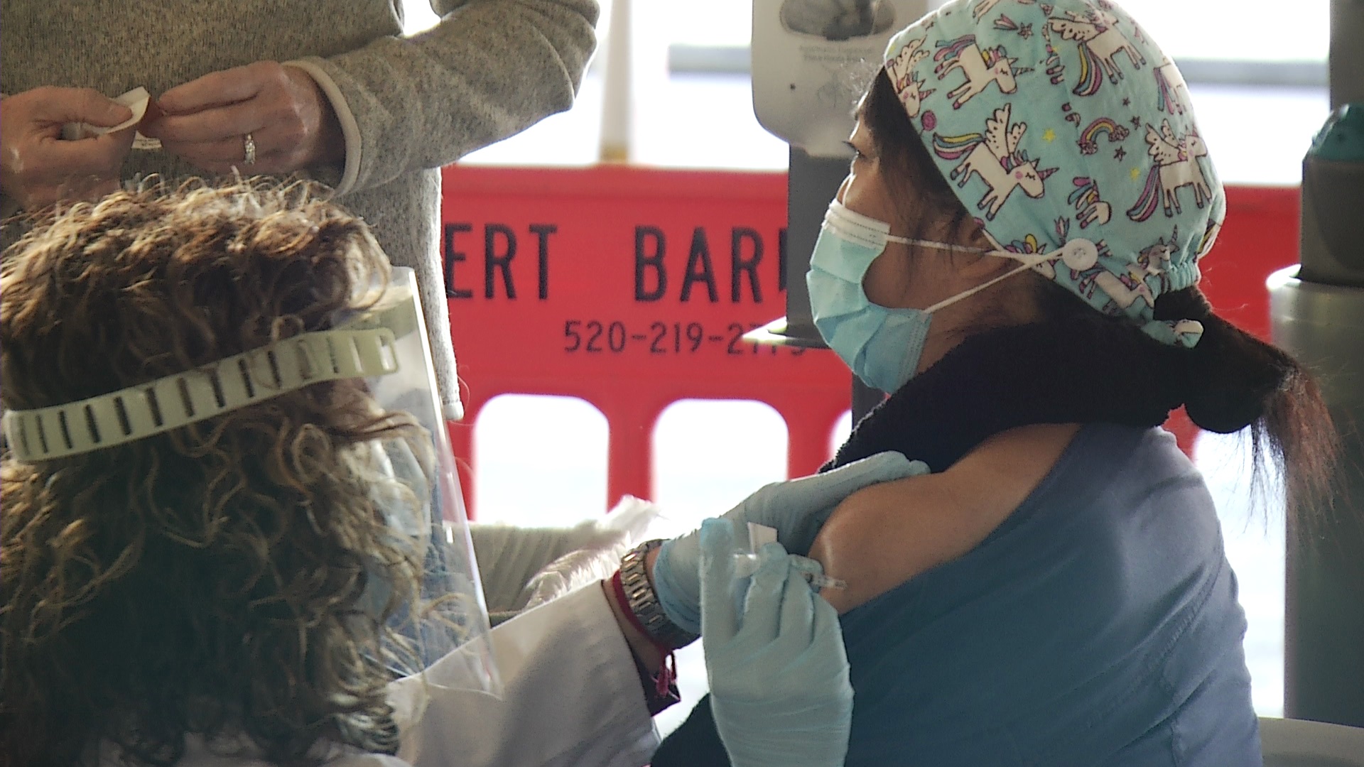 UA Cancer Center oncology nurse Iris Delfakis receives the first shot of COVID-19 vaccine administered at Banner-UMC on Dec. 17, 2020.