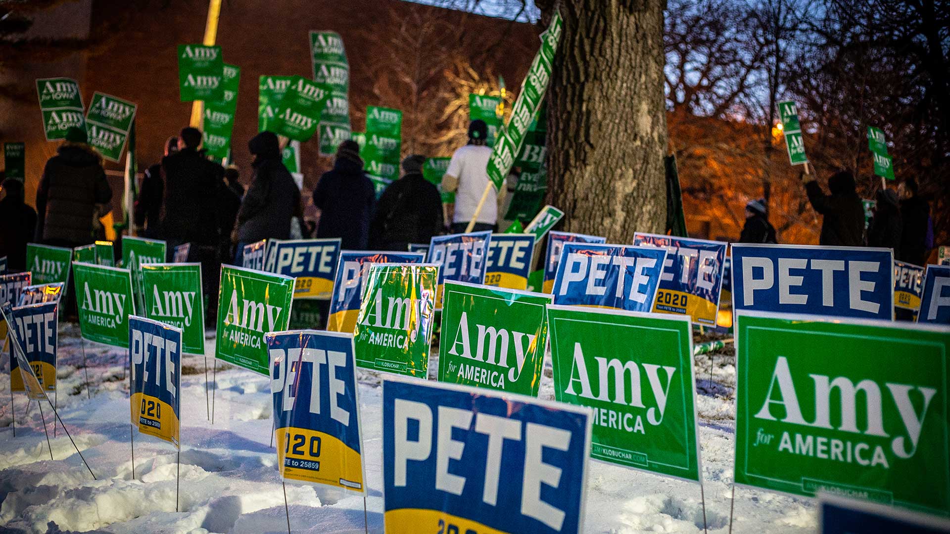 Campaign signs for Democratic presidential hopefuls Pete Buttigieg and Amy Klobuchar compete for attention outside a January debate at Drake University in Iowa. Democrats will bring what’s left of their road show after Super Tuesday to a March 15 debate in Phoenix. 