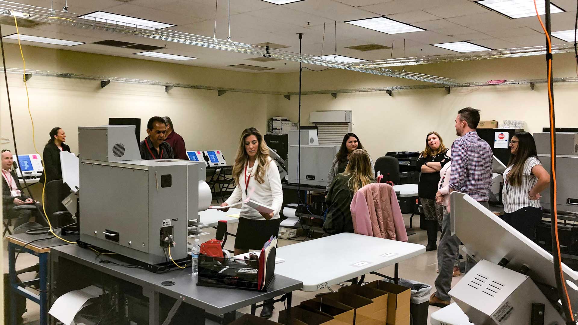 Janine Petty, deputy state elections director, performs logic and accuracy tests on Pima County's vote tabulation machines on Feb. 18, ahead of the 2020 presidential preference election. 