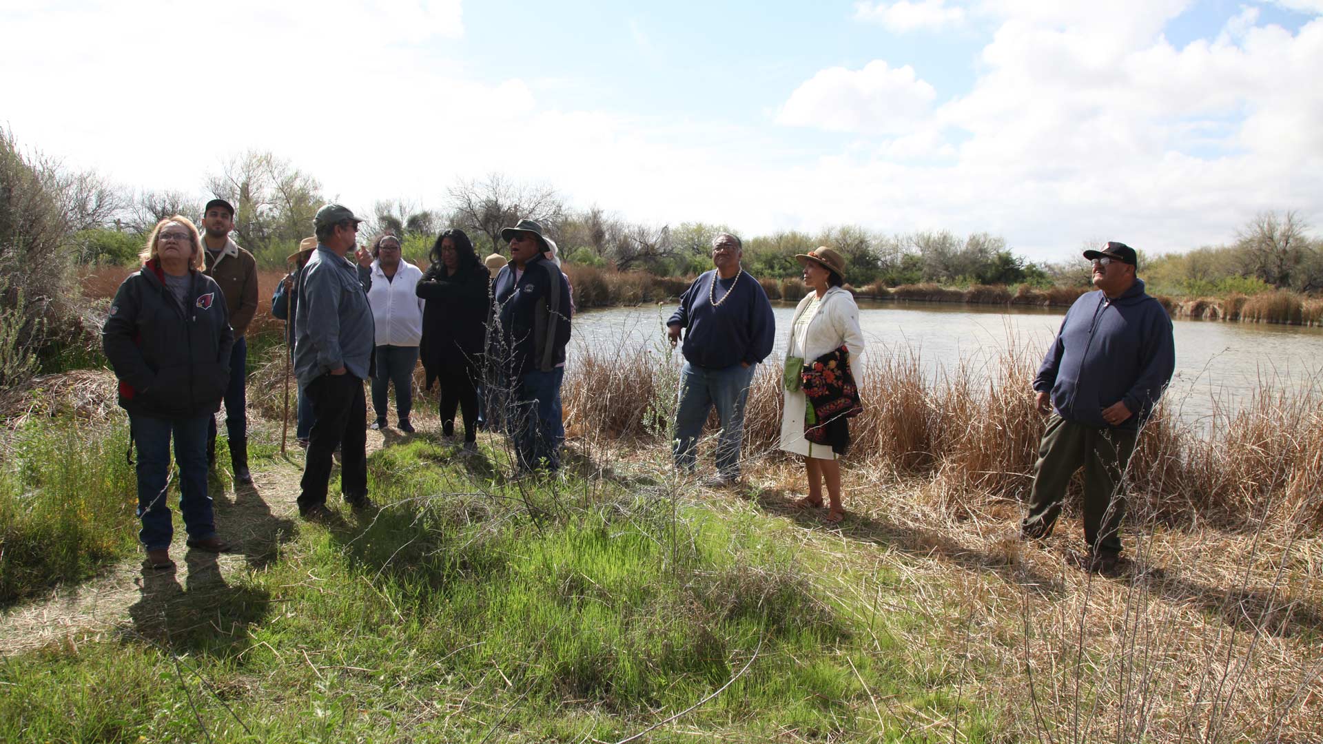 A group of Tohono O'odham, Hia C-ed O'odham, Pascua Yaqui and their non-Indigenous allies gathered, Sunday, March 8, 2020, beside the pond fed by Quitobaquito Springs to discuss how building the border wall and pumping local groundwater to make cement is harming the area cherished by the local Indigenous peoples. 