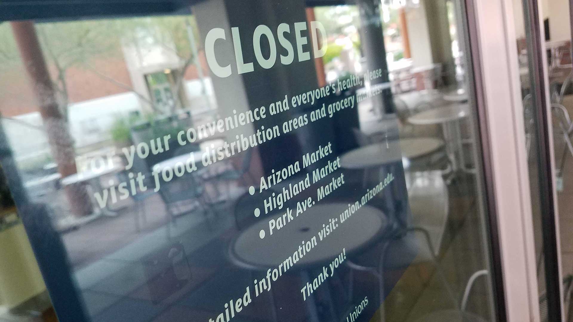 A closed sign at the University of Arizona student union. Classes have all moved online for the spring semester.