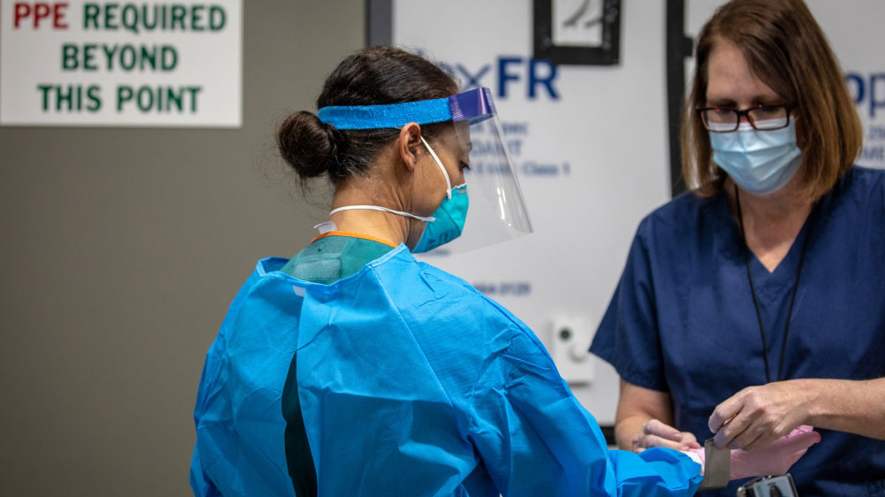 Photo dated April 17 of United States Public Health Service Commissioned Corps helping with personal protective equipment in Detroit.