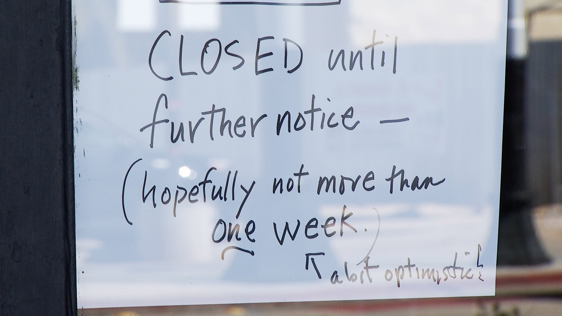 A handwritten sign posted by a business on Fourth Avenue about the store's closure as a result of the COVID-19 pandemic. 