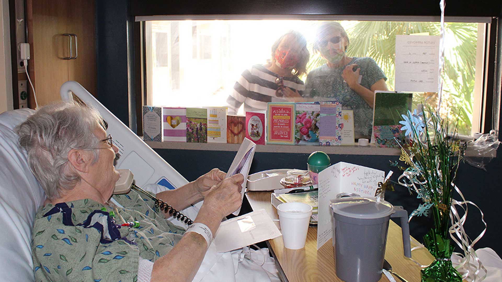 Deborah Ann Resner and Monika Carothers visit TMC patient Ruth during the COVID-19 pandemic, April 14, 2020.