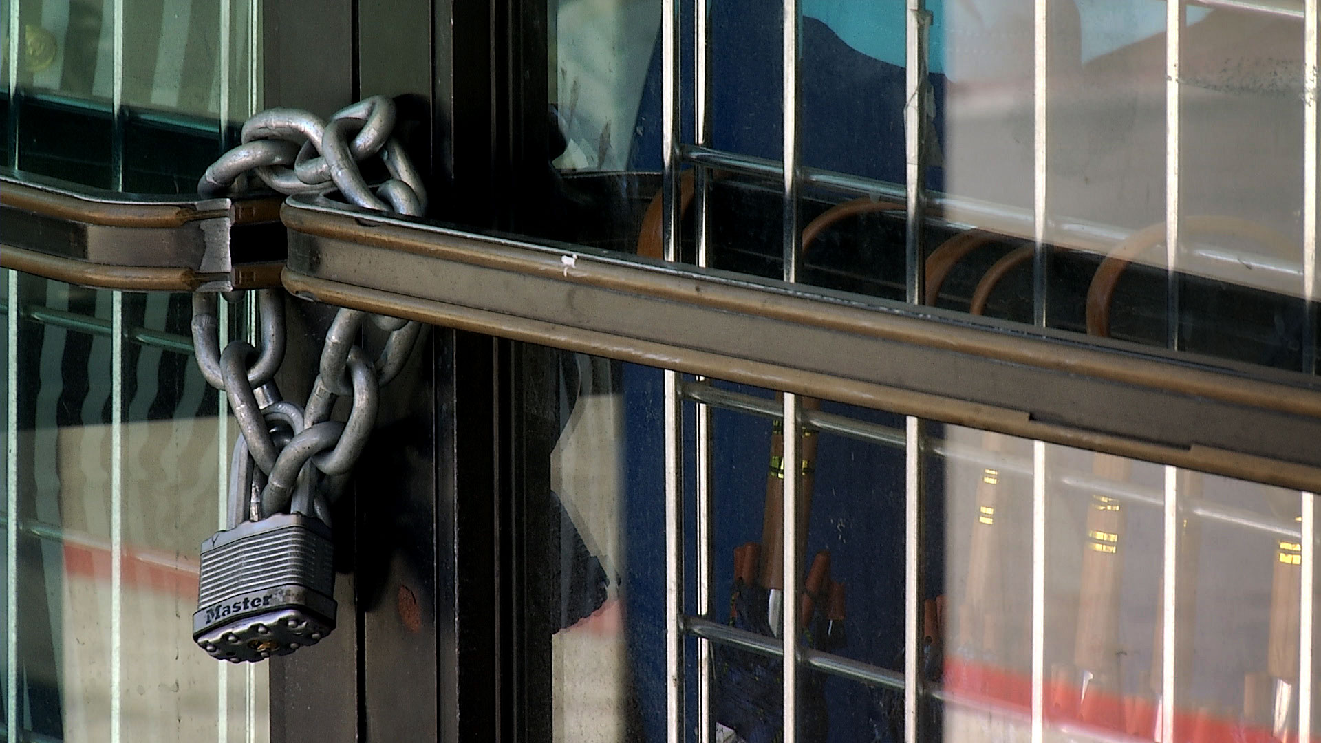 File image of a chain and padlock on the doors of a business in Nogales, Arizona. March 2020. 