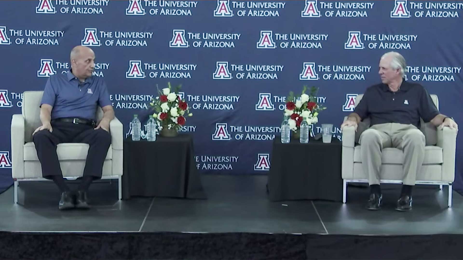 Dr. Richard Carmona and University of Arizona President Robert Robbins sit at a news briefing on opening the UA campus, May 20, 2020