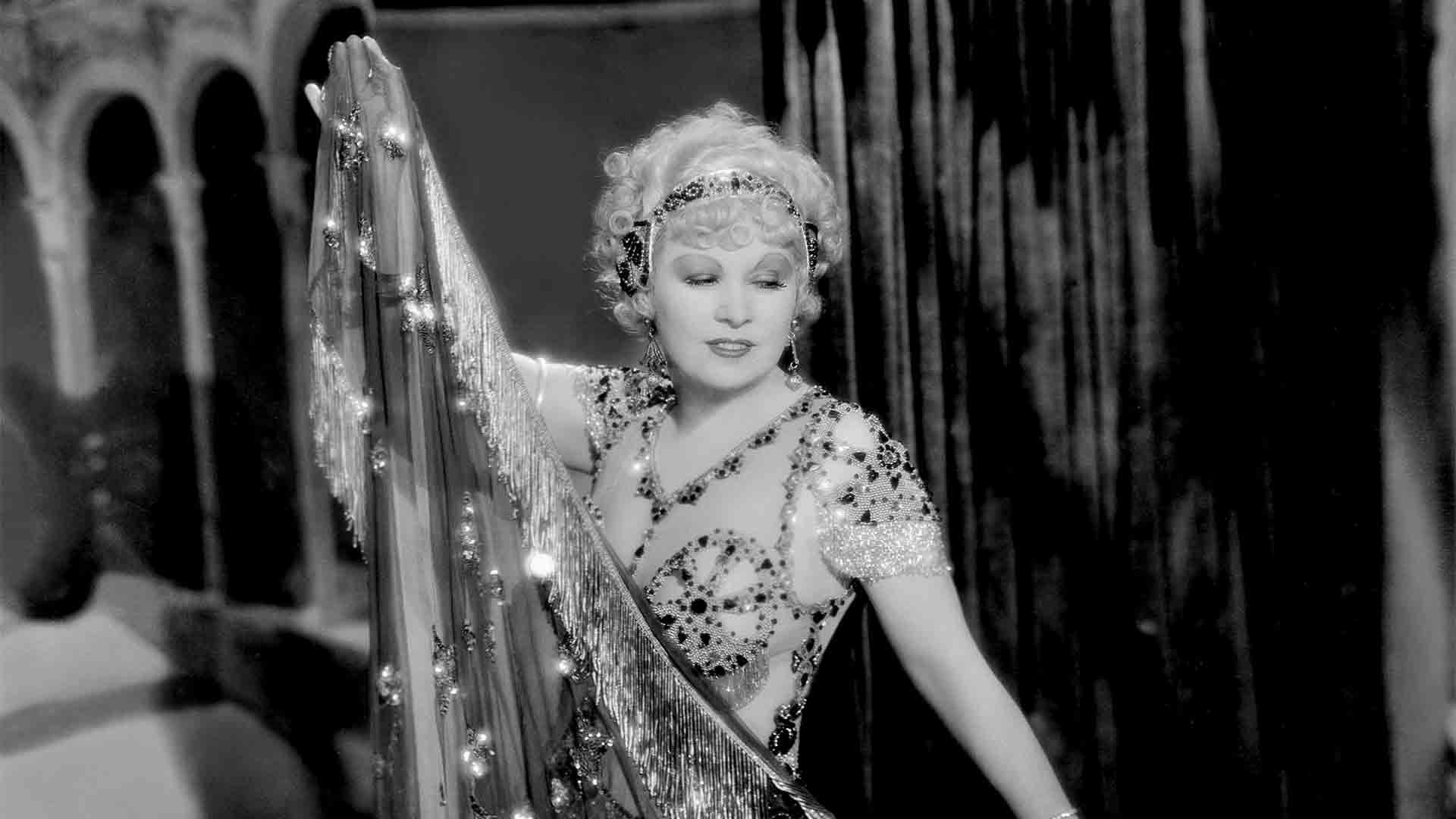 Mae West as Tira does a "muscle dance" in the film I'm No Angel, 1933.