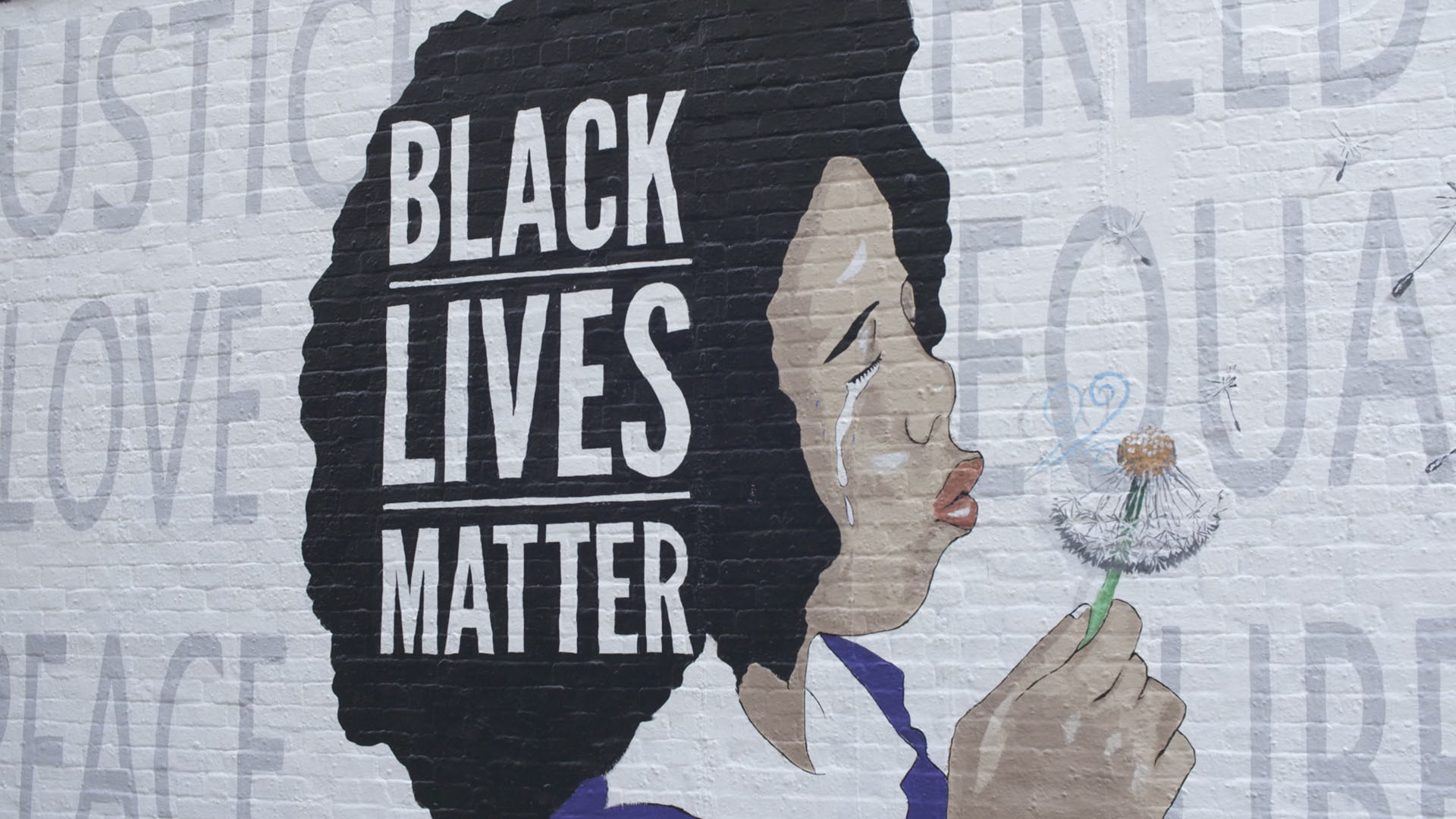 A Black Lives Matter mural painted by Robbie Lee Harris June 2020 at Tucson's Rialto Theatre.