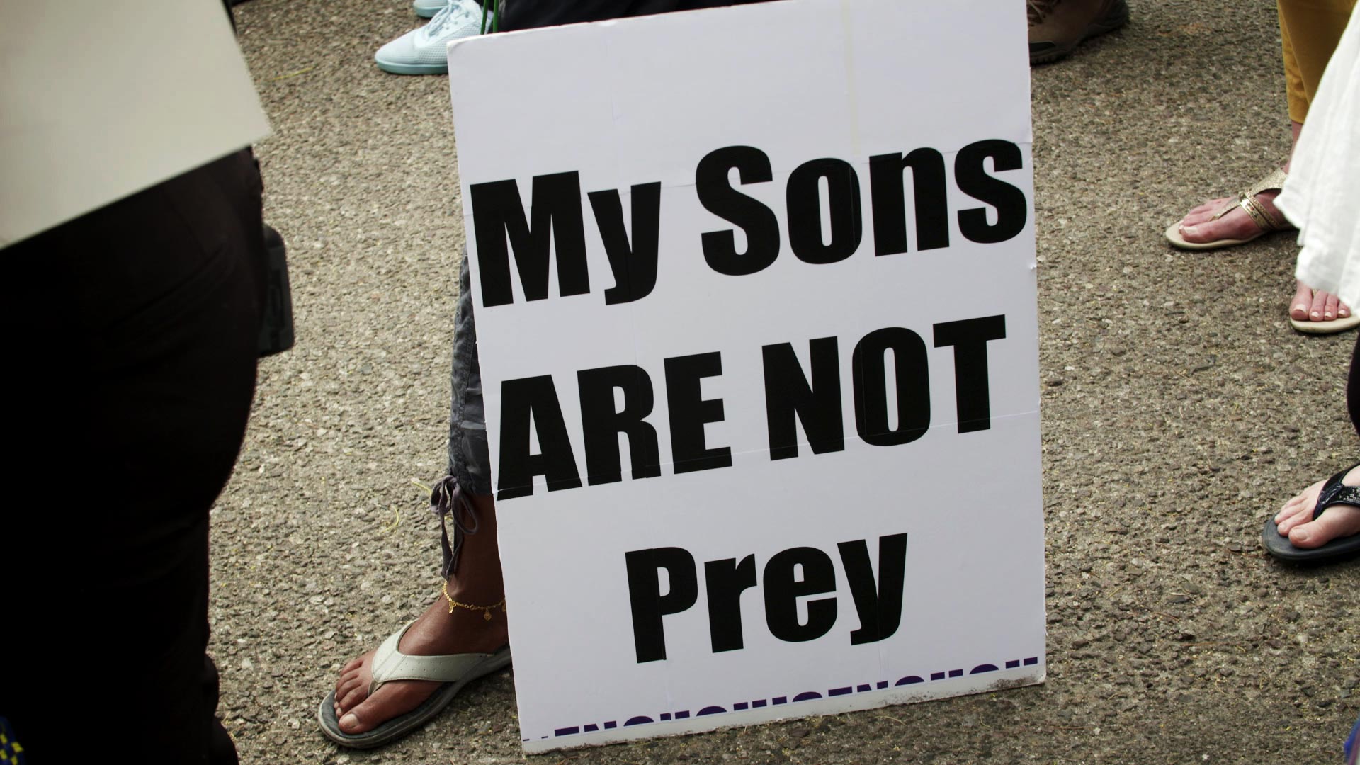 A sign protesting racial injustice at a candlelight vigil held in memory of George Floyd at the Dunbar Pavilion in Tucson on June 1, 2020. 