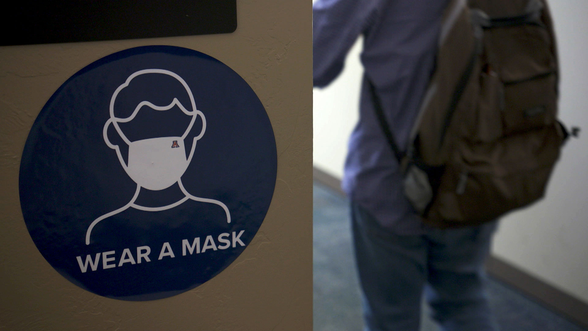 Signage inside a building at the University of Arizona promotes mask wearing on campus, July 2020. 